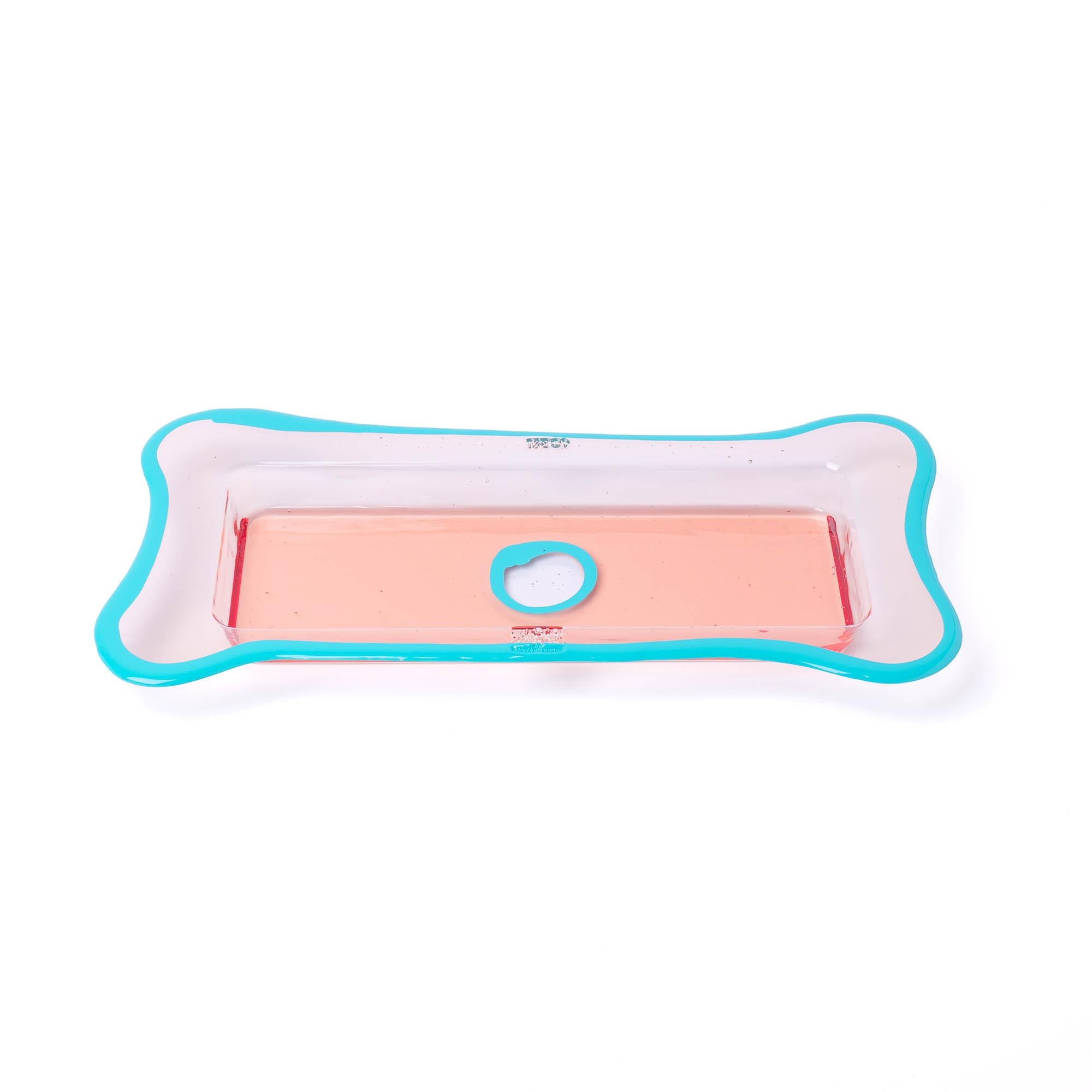 Try-Tray rectangular - Clear ruby, matt turquoise
Tray in hard resin designed by Gaetano Pesce in 1998 for Fish Design collection.

Colours: Clear ruby, matt turquoise
Dimensions: 31cm x D 16cm
Material: RESIN
Tray in hard resin designed by Gaetano