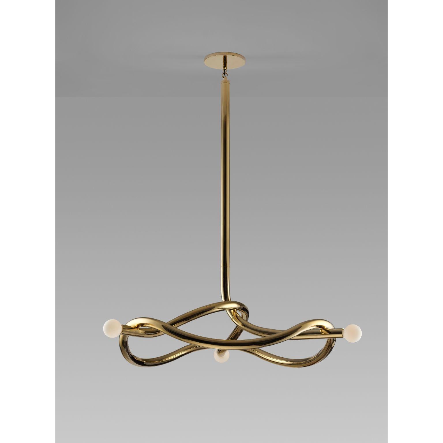Tryst three chandelier by Paul Matter.
Materials: brass and porcelain finish glass.
Dimensions: W 114.3 x H 182.8 cm.
Wight: 15 kg.

Tryst chandelier explores the relationship between interlocked forms in perfect union and balance. A study of