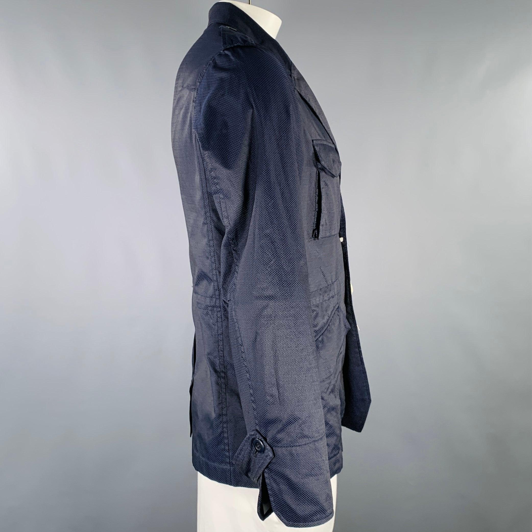 TS (S) hacking jacket
in a textured navy cotton featuring a notch lapel, four snap pockets, and button closure. Made in Japan.New with Tags. 

Marked:   JP 5 

Measurements: 
 
Shoulder: 18 inches Chest: 43 inches Sleeve: 26 inches Length: 29.5