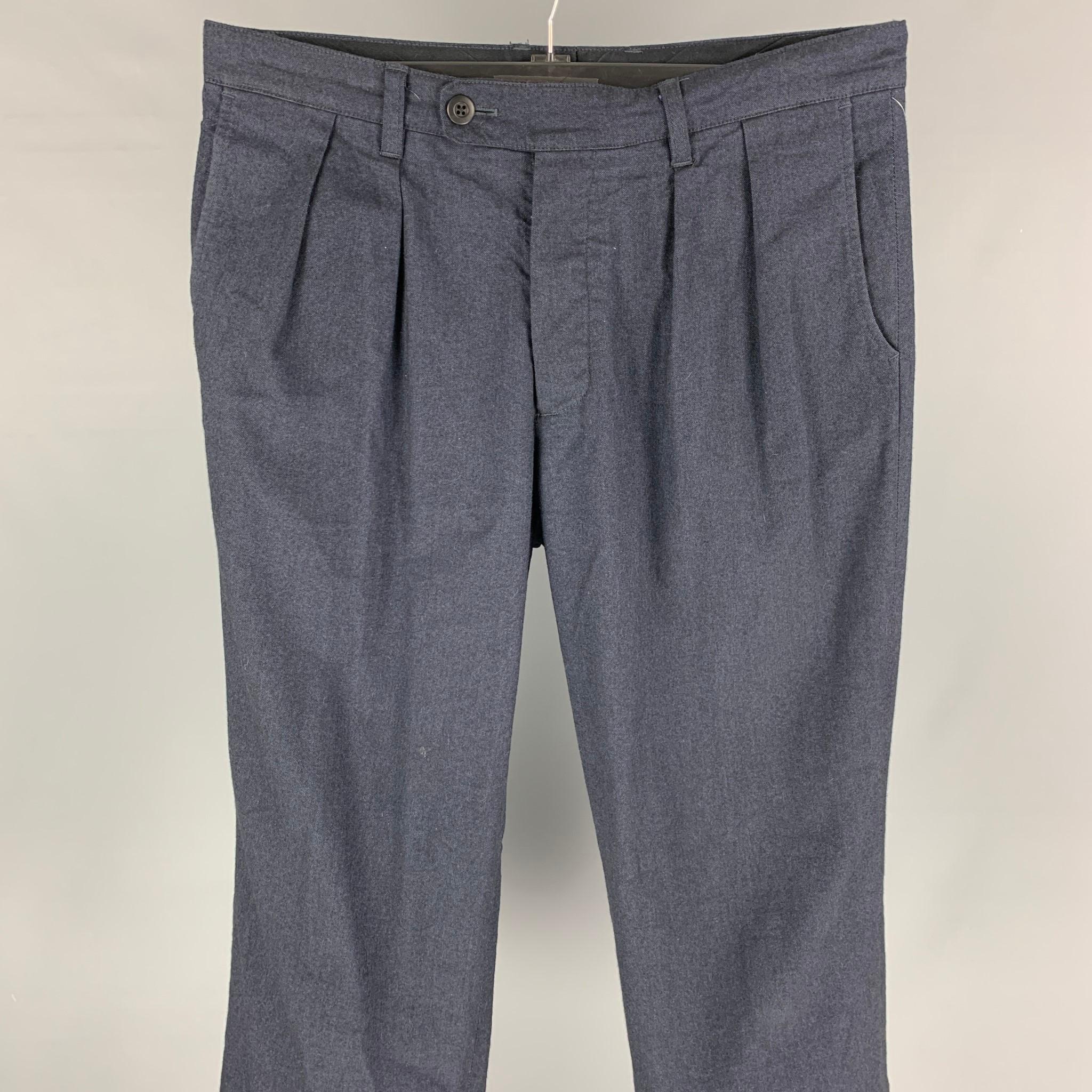 TS (S) dress pants comes in a indigo cotton blend featuring a pleated style, wide leg, cuffed, and a button fly closure. Made in Japan. 

Very Good Pre-Owned Condition.
Marked: 2
Original Retail Price: $440.00

Measurements:

Waist: 34 in.
Rise: