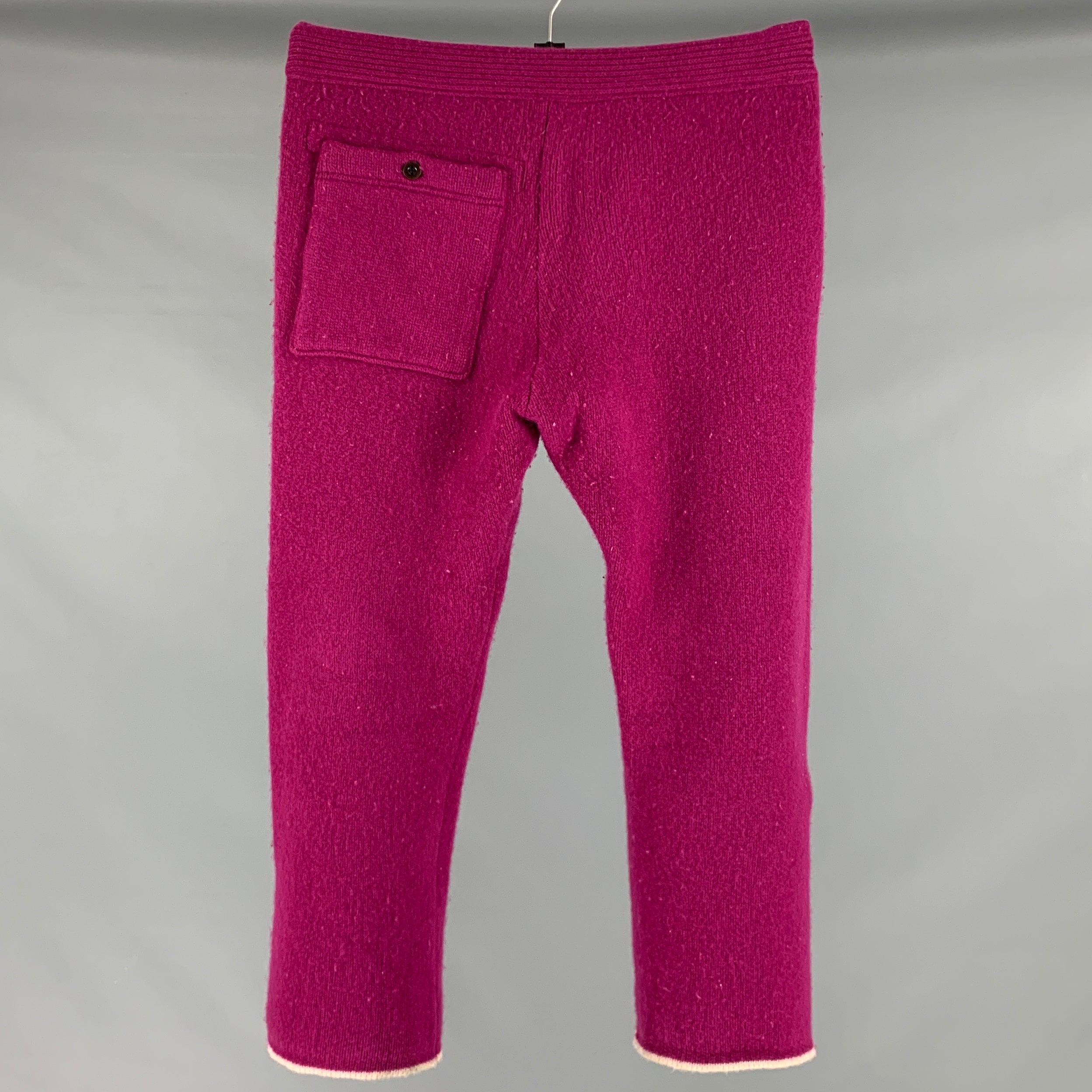 TS(S) casual pants in a purple wool blend knit featuring a ribbed style, contrast cream trim, and drawstring waist. Made in Japan.Good Pre-Owned Condition. Moderate signs of wear and pilling. 

Marked:   M 

Measurements: 
  Waist: 32 inches Rise: