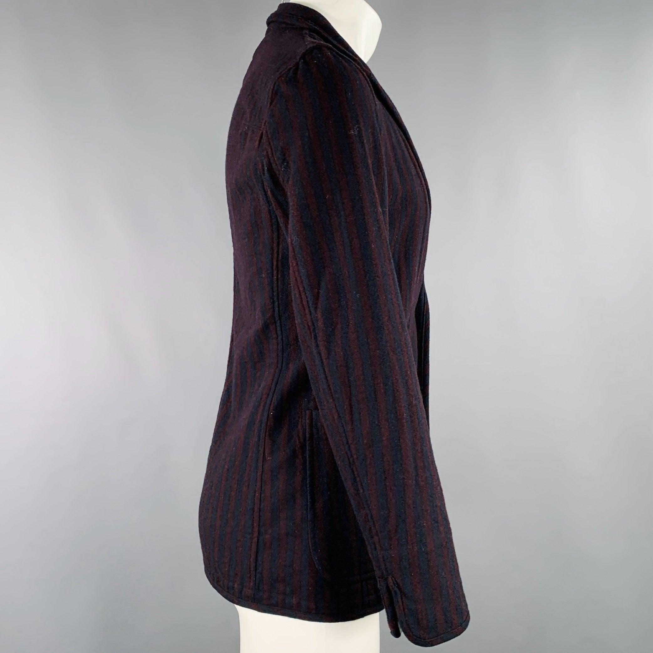 Giacca TS (S)
in tessuto misto lana bordeaux e navy con motivo a righe, tre tasche e chiusura a due bottoni. Made in Japan.Eccellente condizione di usato. 

Contrassegnato:   JP 2, si adatta a S 

Misure: 
 
Spalla: 16,5 pollici Petto: 38 pollici
