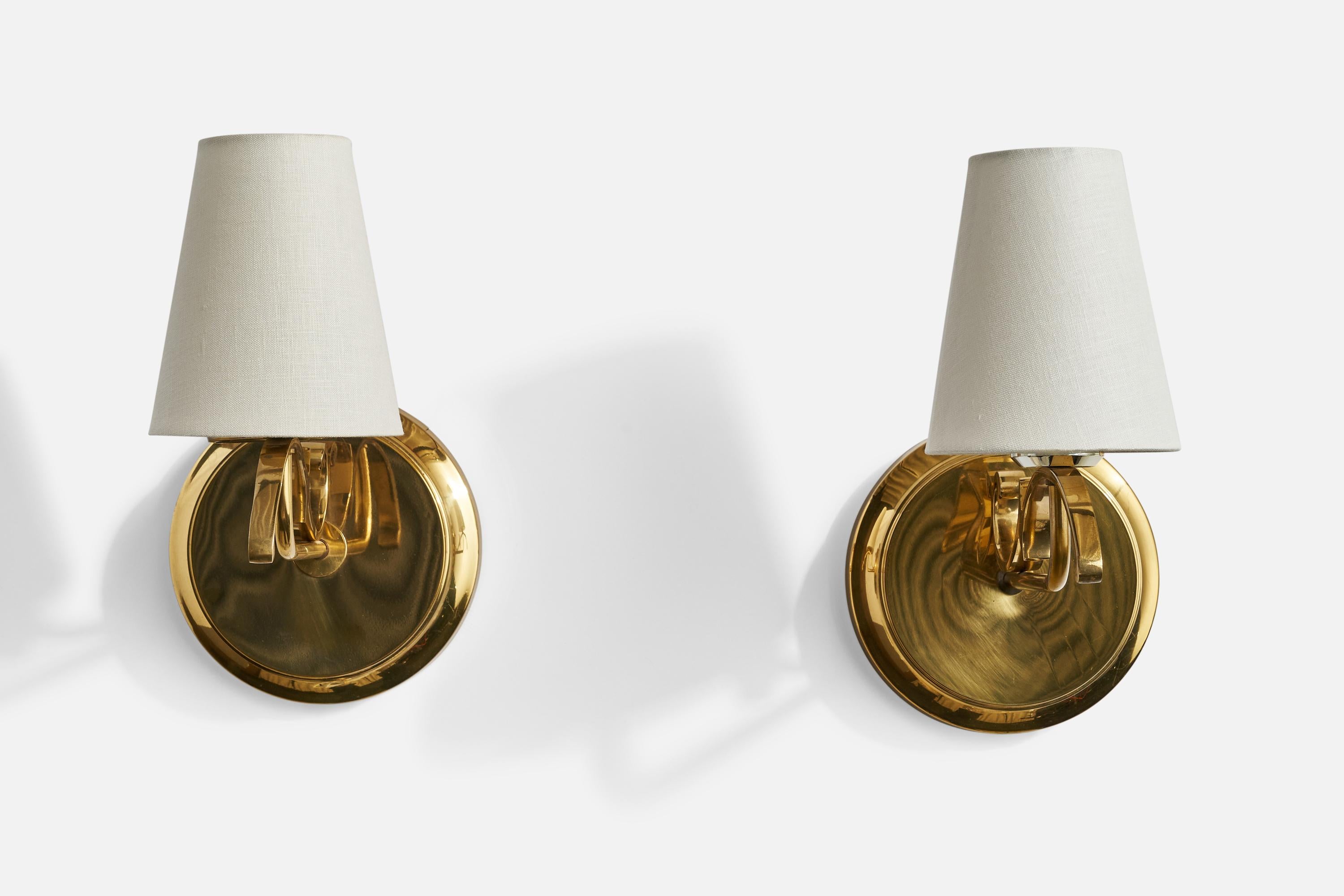 A pair of brass and white fabric wall lights designed and produced by TSAR, Sweden, 1970s.

Overall Dimensions (inches): 12” H x 5” W x 10.5”  D
Back Plate Dimensions (inches): 7.25”  H x 7.25”  W x 2” D
Bulb Specifications: E-26 Bulb
Number of