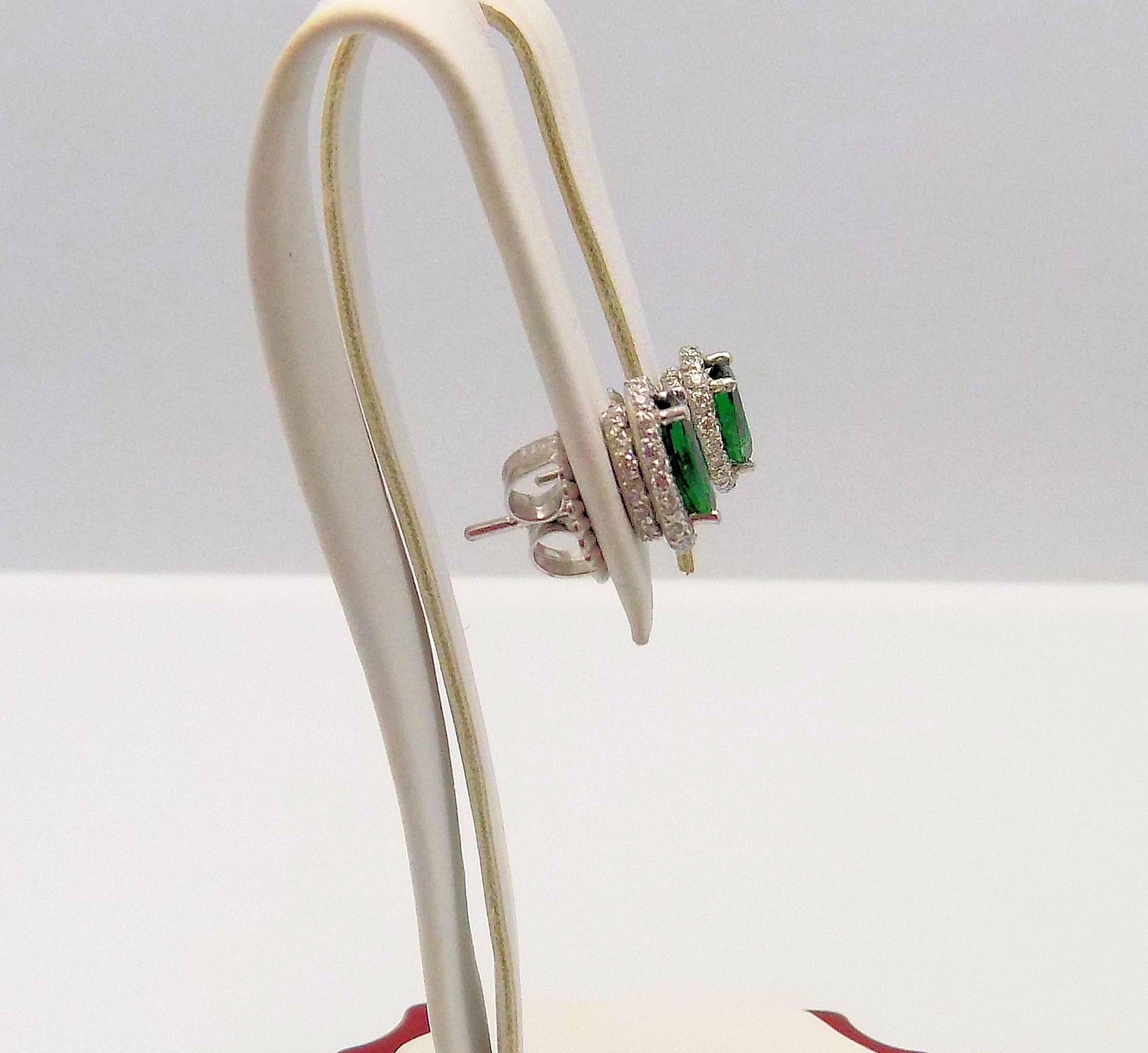 Oval Cut Tsavorite and Diamond Stud Earrings in 14 Karat White Gold For Sale