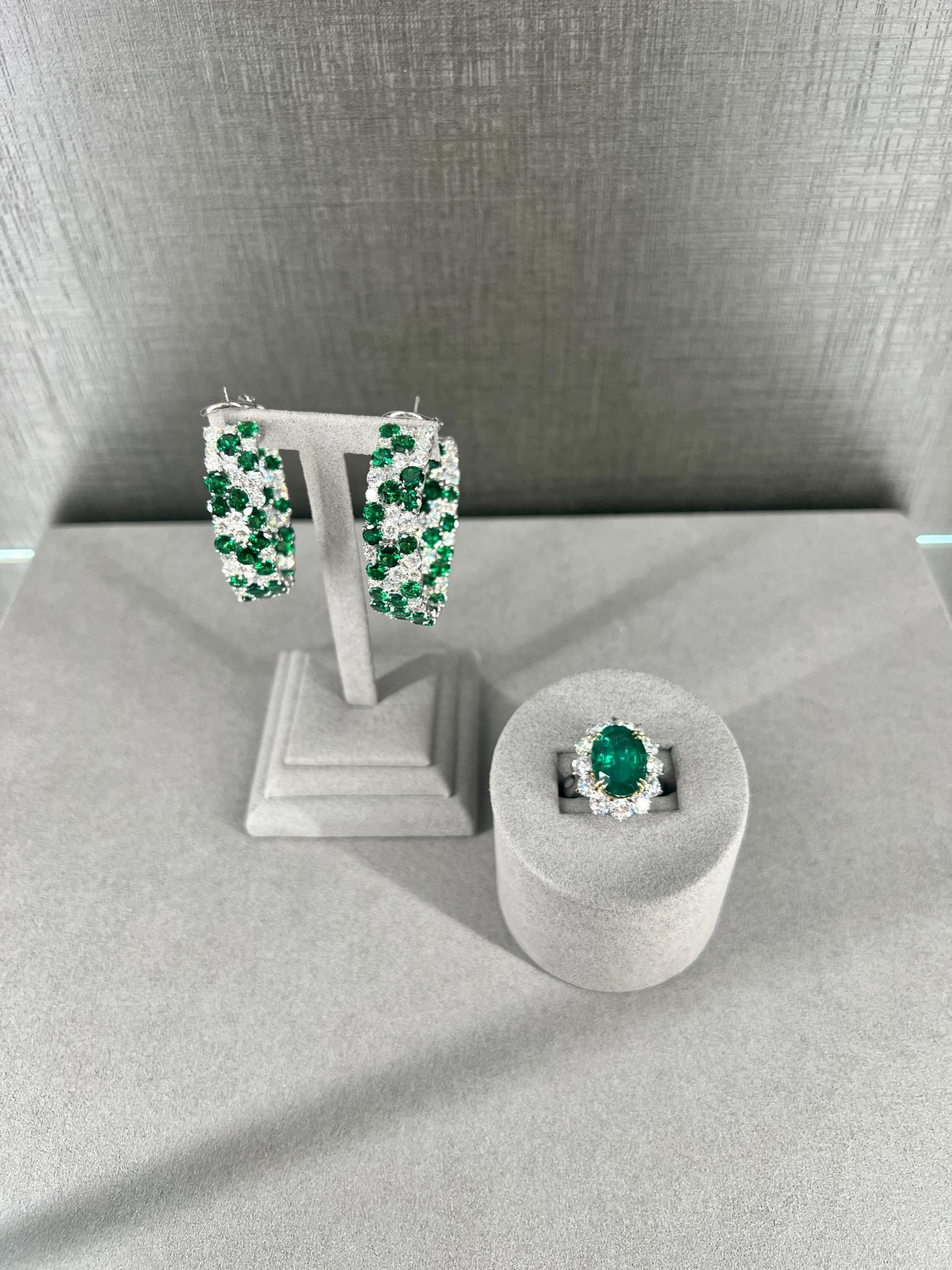 Tsavorite and diamond hoops are a beautiful and unique style of earrings that can add a pop of color and sparkle to any outfit. Tsavorite is a type of garnet that is known for its bright green color, and when paired with diamonds, it creates a