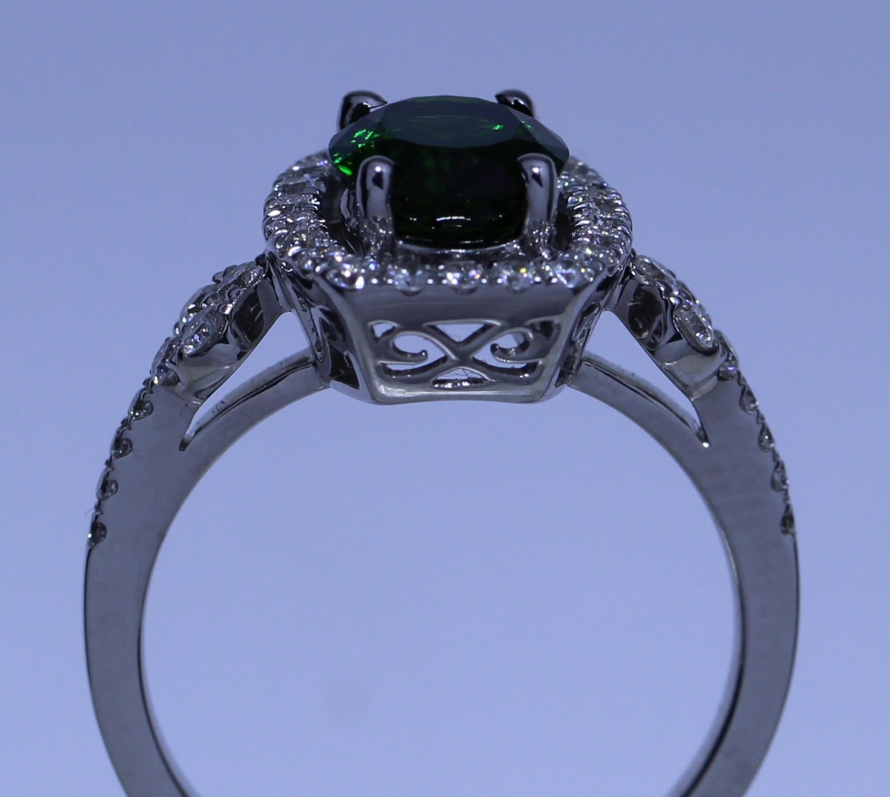 Top quality lush green oval Tsavorite 1.40carat with Diamonds .53carat in 18k white gold

