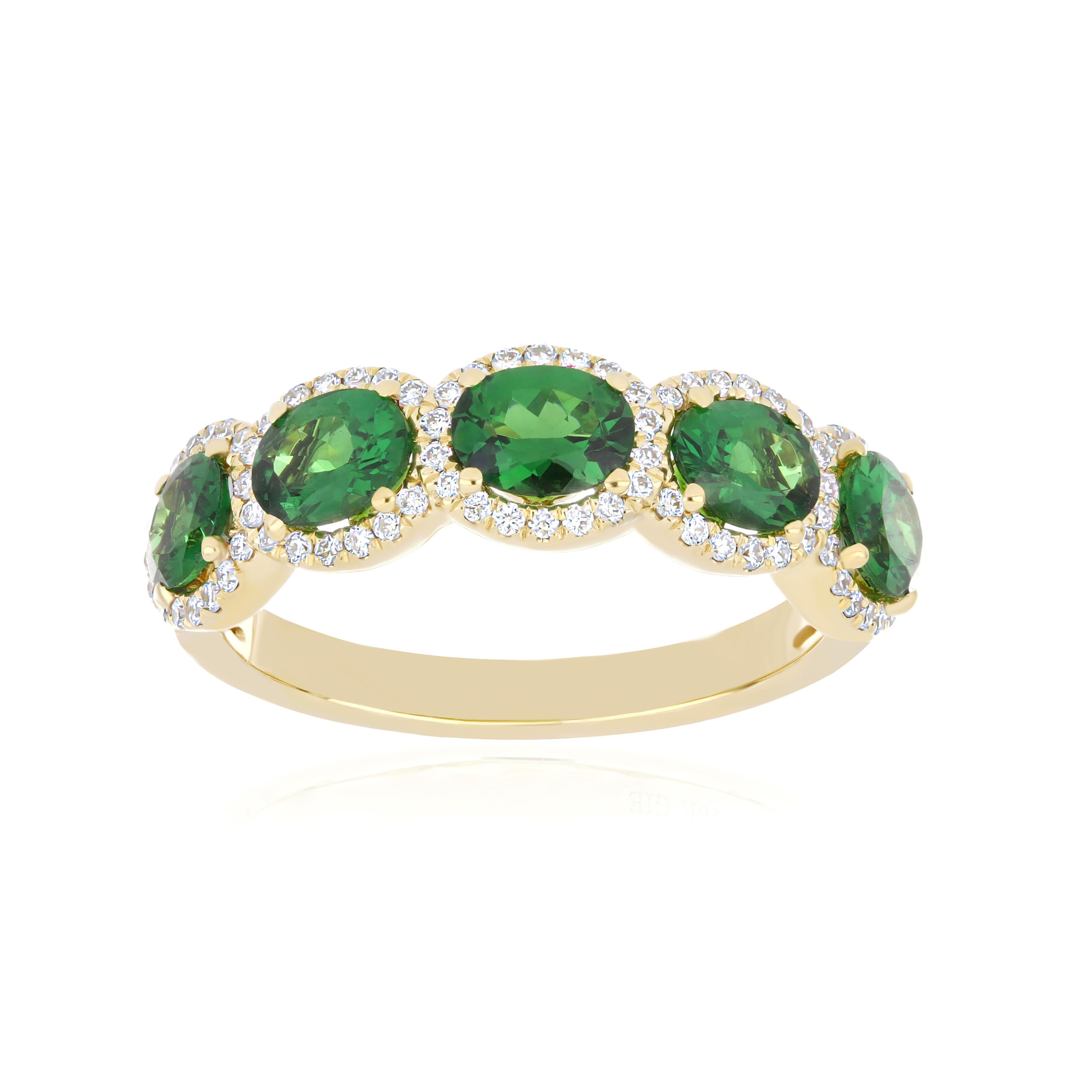 Elegant and Exquisitely detailed Yellow Gold Ring, with a rare 1.85 Cts (approx.) Oval Shape Faceted Cut Tsavorite set in the center beautifully accented with Micro pave set Diamonds, weighing approx. 0.25 CT's (approx.). total carat weight to