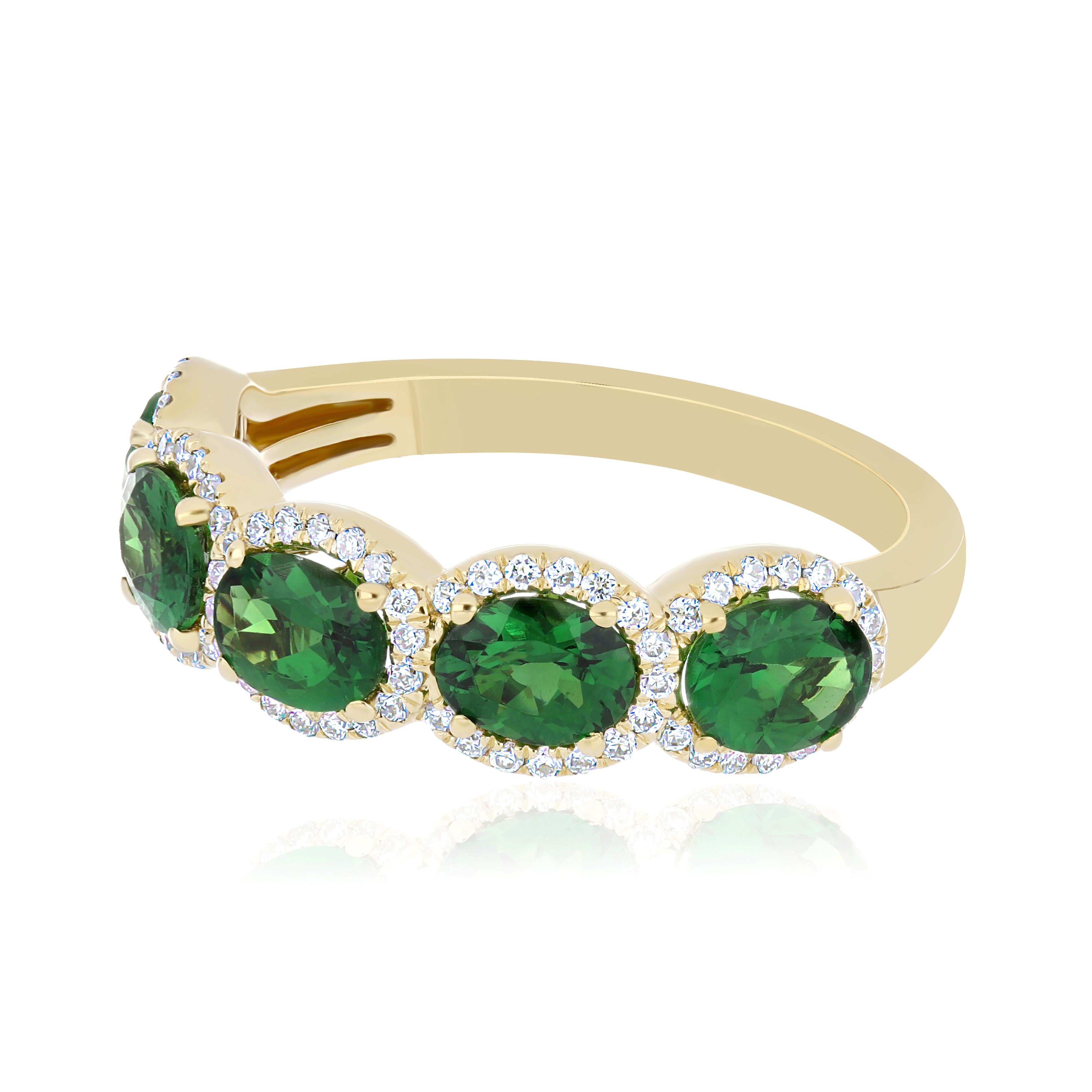Oval Cut Tsavorite and Diamond Studded hand-crafted ring in 18 Karat Yellow Gold For Sale
