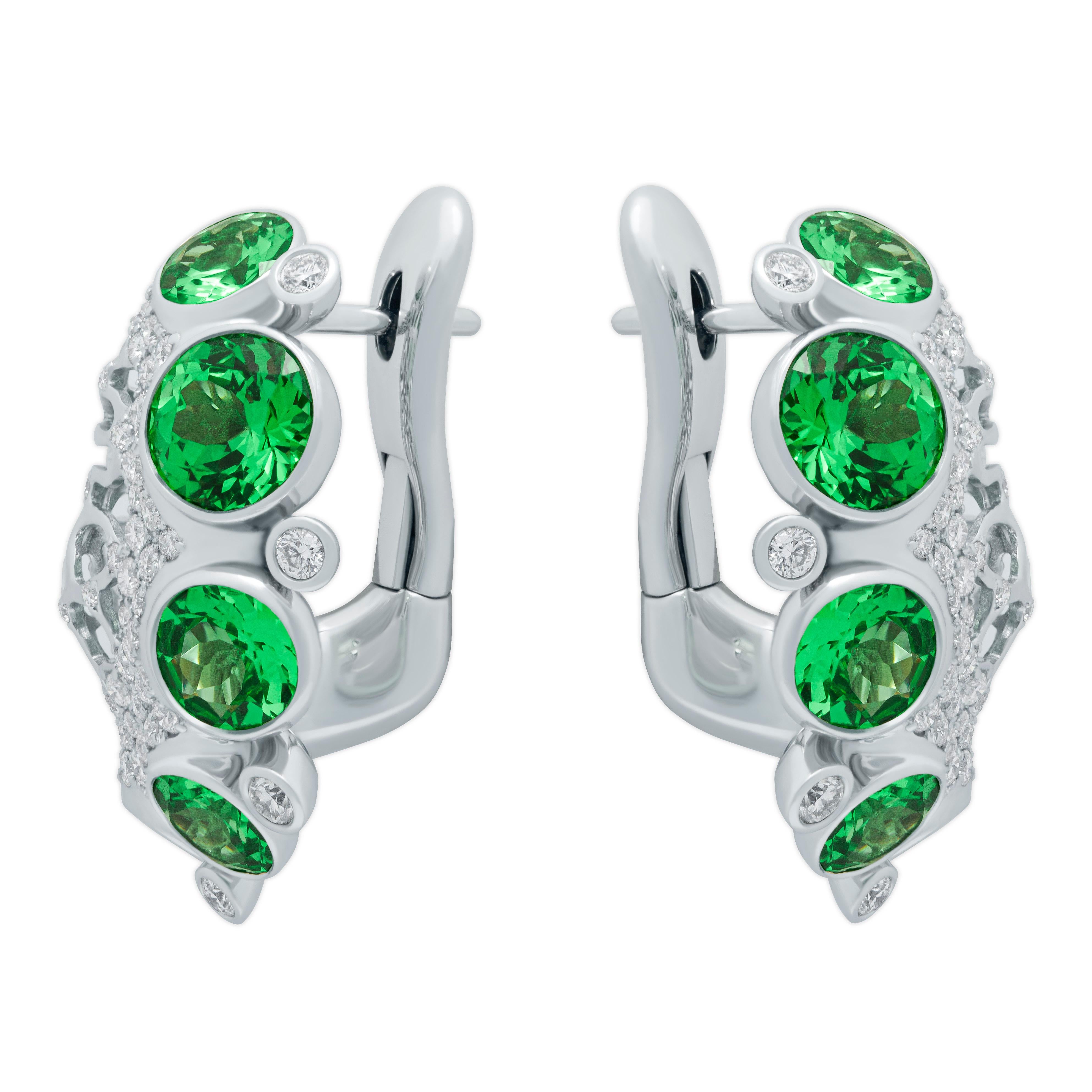 Tsavorite and Diamonds 18 Karat White Gold Earrings

Pure Green color in combination with Diamonds looks stunning from our Coral Reef Collection
Accompanied with the ring LU116414714581

14.50 x 24.20 mm (WxL)
Weight - 9.79 gm
