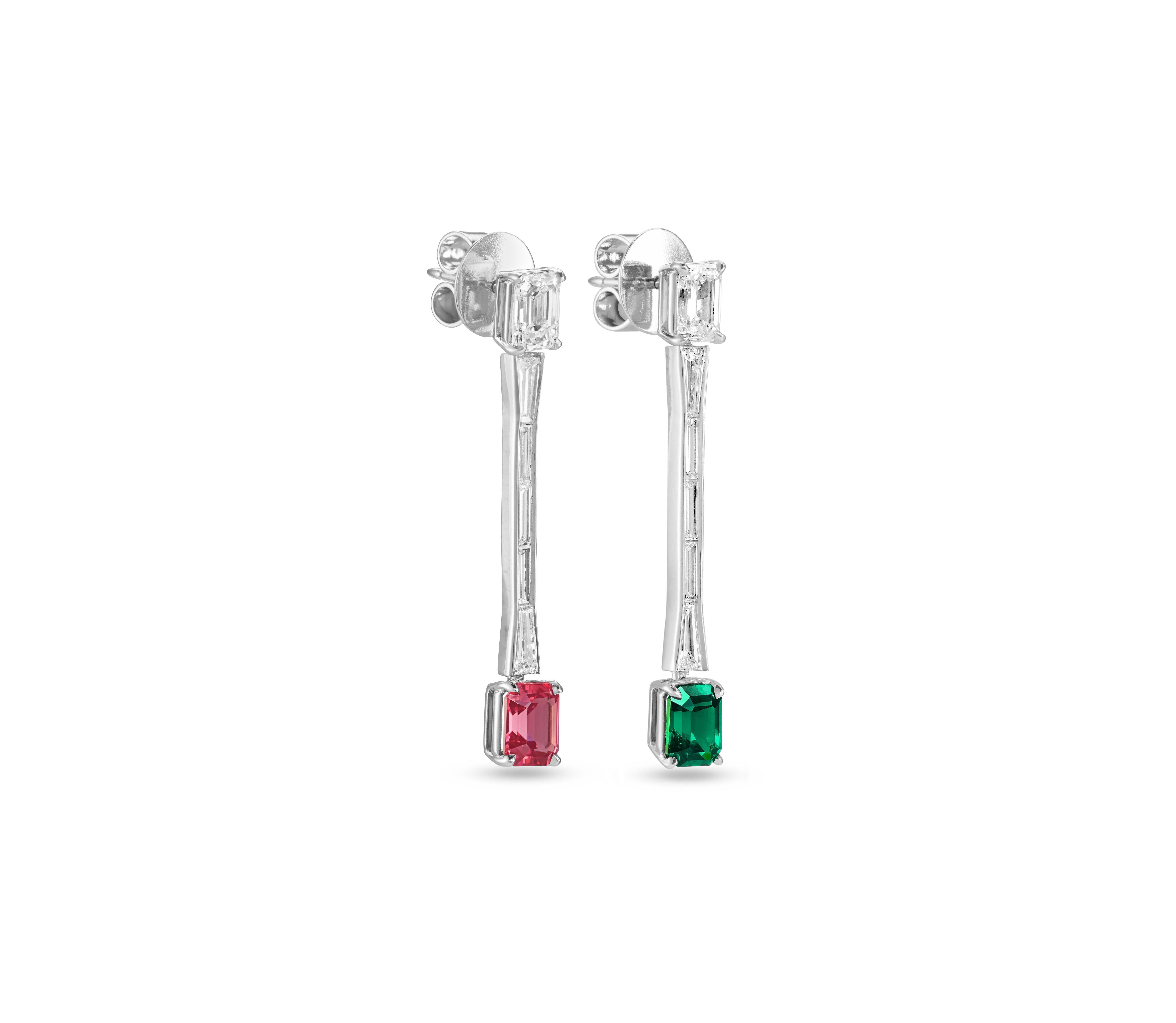 One earring has a 1.18 ct. Tsavorite Garnet and the other earring has a 1.08 ct. Mahenge Spinel.
The total diamond weight is 2.61 ct.: 1.44 ct. emerald-cut E VVS diamonds, 0.67 ct. tapered baguette E VVS-VS diamonds, 0.50 ct. baguette-cut F VS