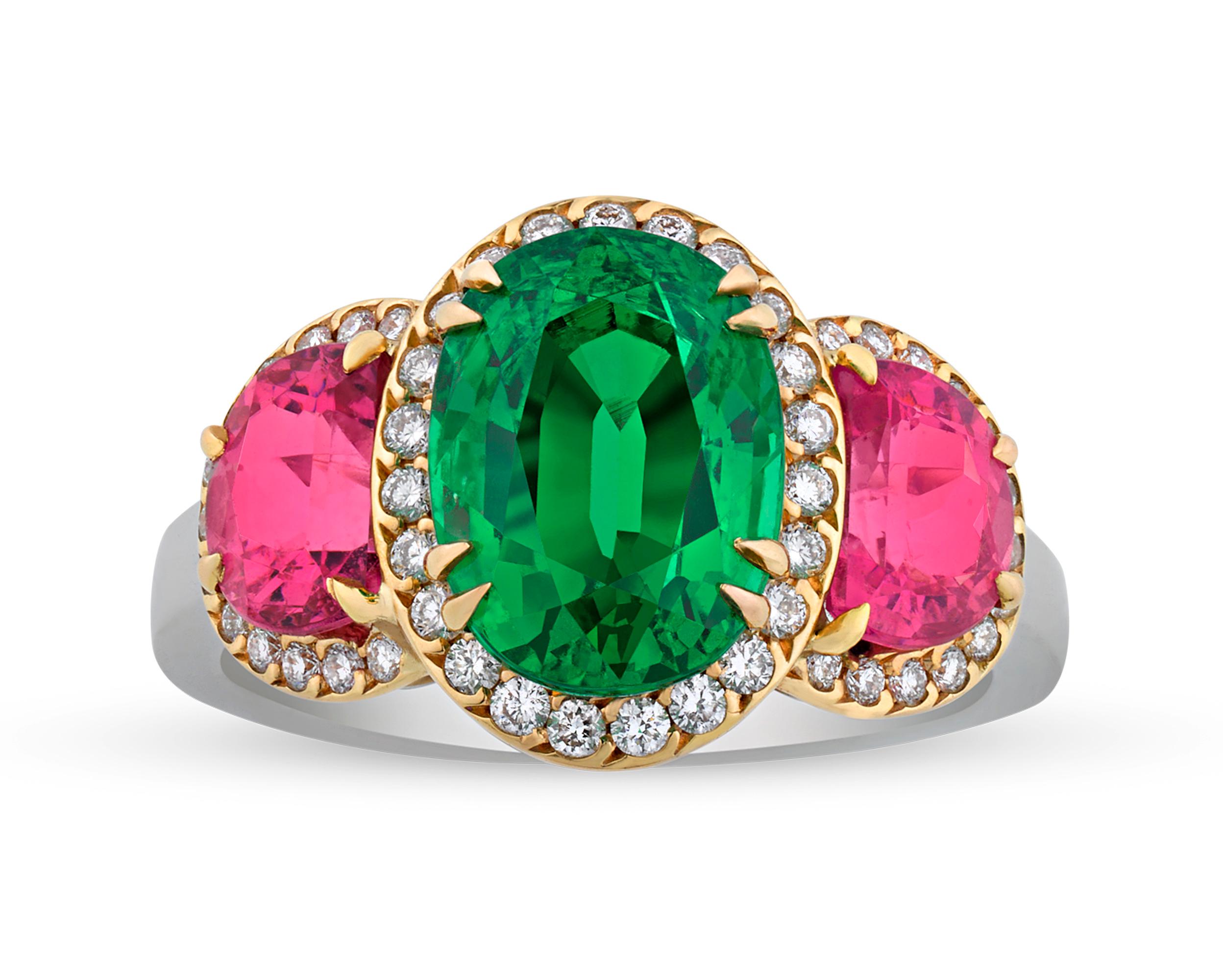 This eye-catching ring celebrates color, contrasting the rich emerald green of a tsavorite garnet with the spirited pink of a Mahenge spinel. The natural tsavorite at the center, weighing 3.89 carats, is perfectly complemented by two natural Mahenge