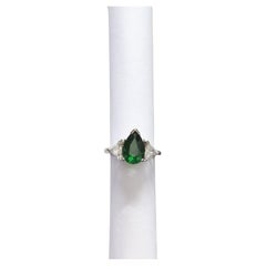 Tsavorite and White Diamond Three Stone Ring in Platinum