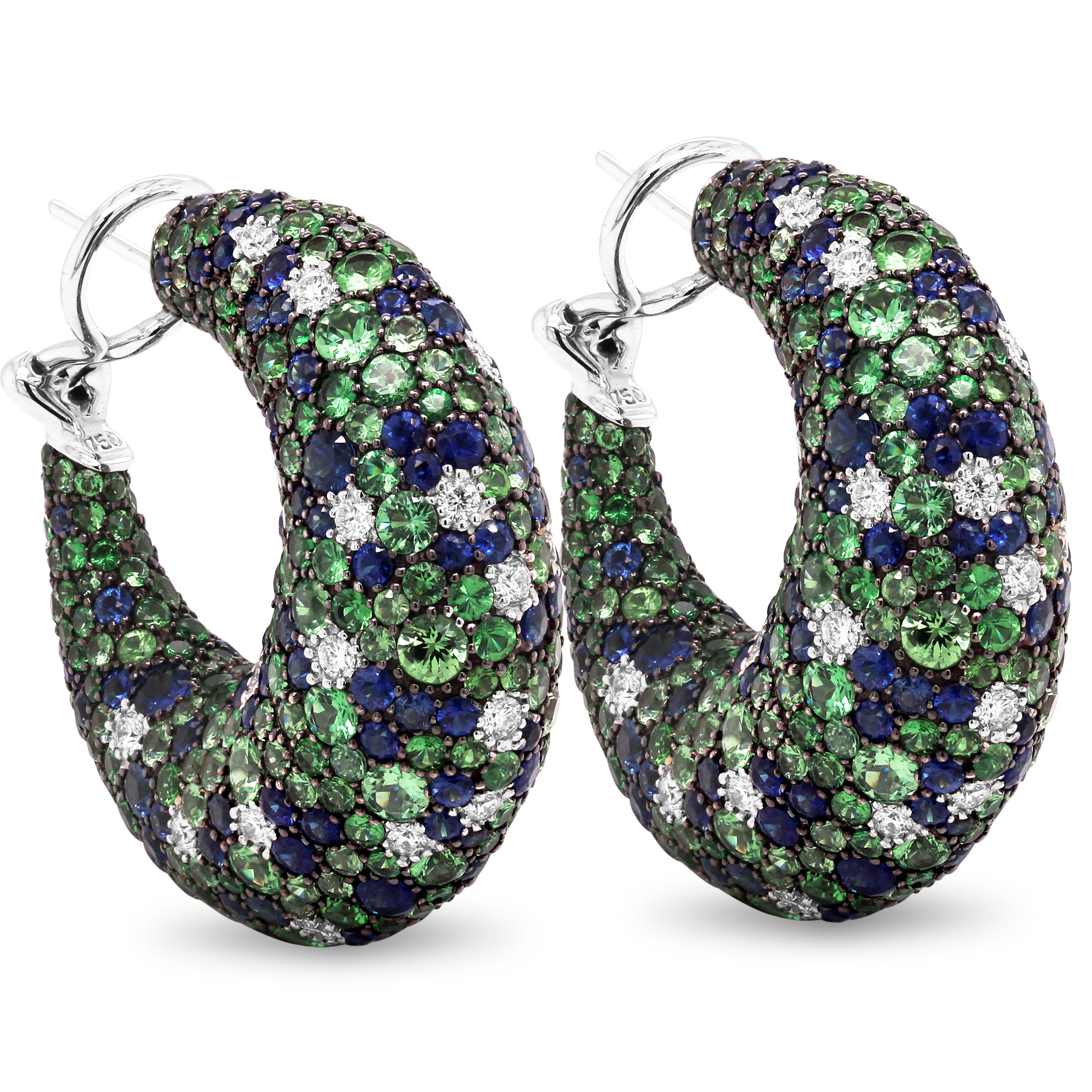 Tsavorite Blue Sapphire Diamond 18K White Gold Inside Out Hoop Earrings

These earrings are to die for with this exceptional design that features shaded Tsavorites from light to dark green mixed with the blue sapphires and diamonds. Stones are set