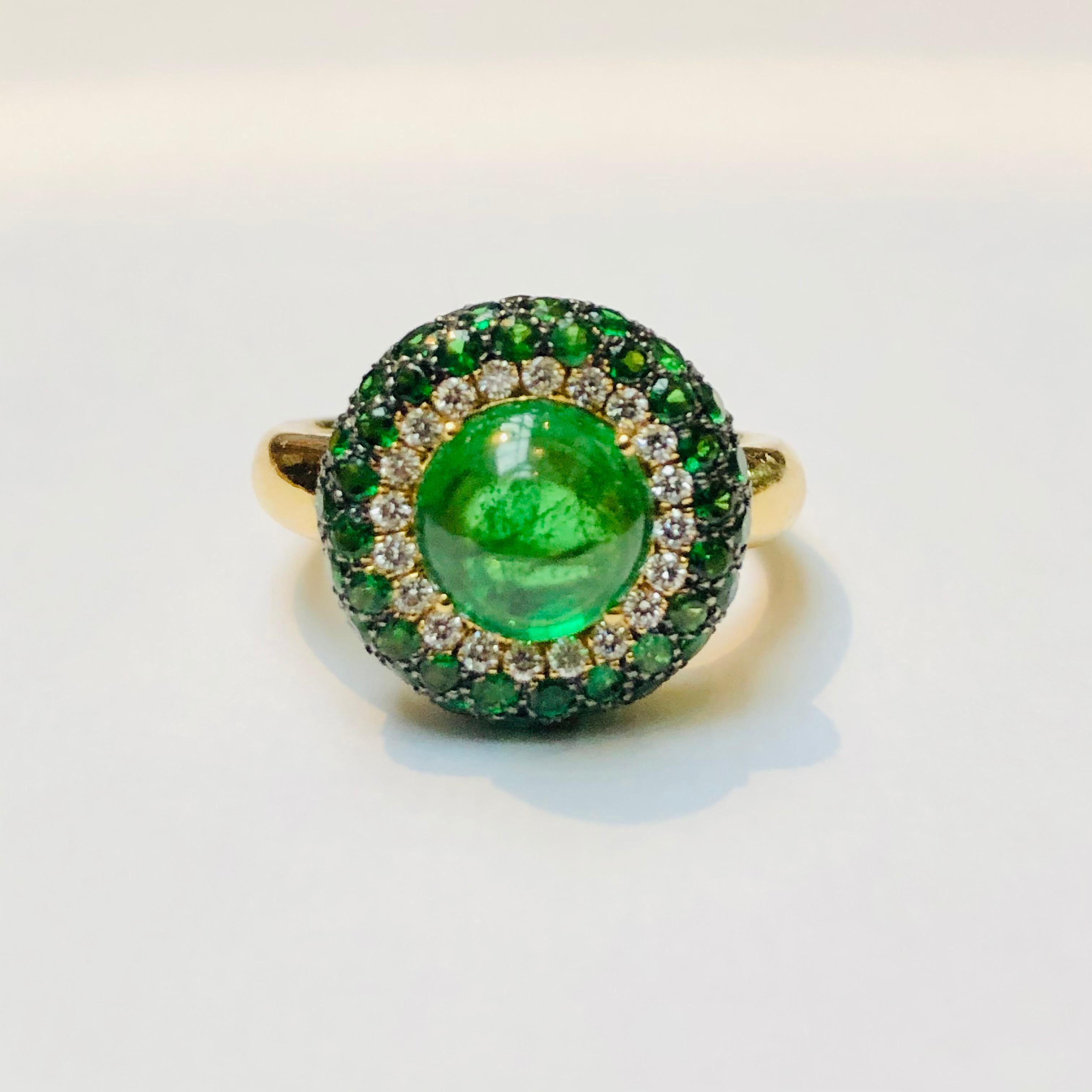 Tsavorite Cabochon Cocktail Ring, 18 Carat Yellow Gold, Made in Italy. Bullseye Target ring featiring a cabochon tsavorite surrounded by pave tsavorite with a yellow gold shank. 