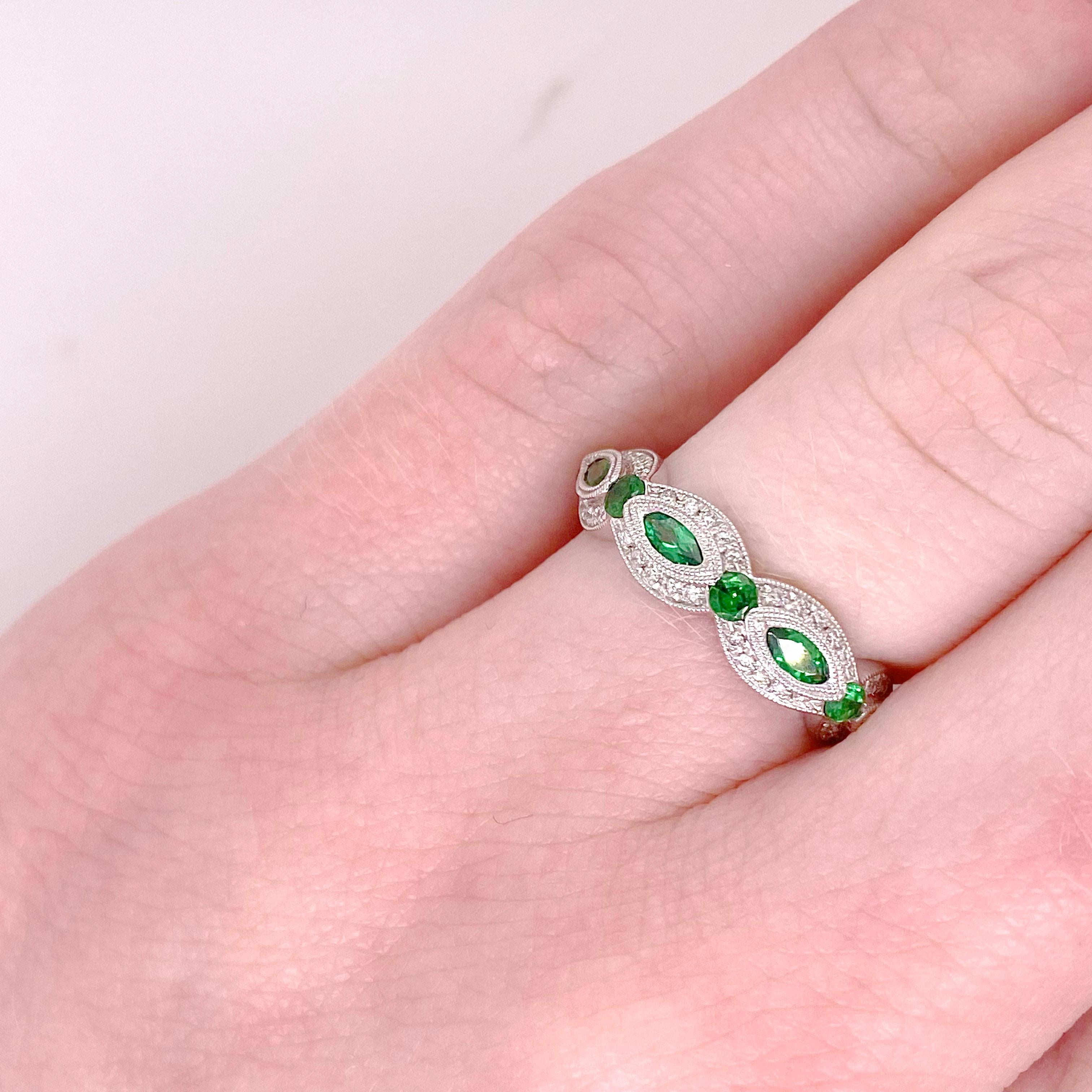 Authentic tsavorite gemstones and natural diamonds embellish this gorgeous band. The band is perfect as an anniversary band, a wedding band or a stackable band. Most people look at these amazing green gemstones and think that they are emeralds but