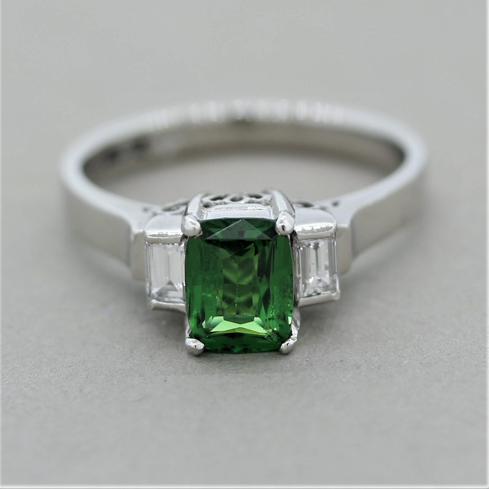 A classic 3-stone ring featuring a superb gem quality tsavorite weighing 1.10 carats. It has the ideal vivid pure green color with excellent brightness and brilliance. It is accented by 2 baguette cut diamonds set on the sides of the tsavorite and