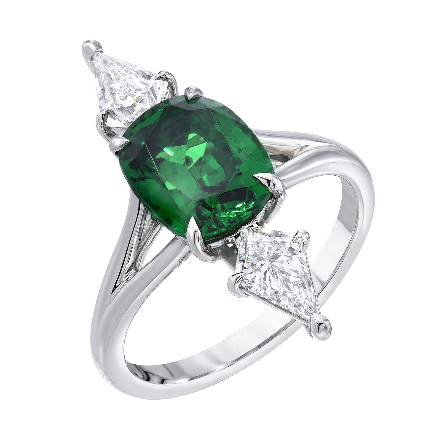 Ultra fine 2.70 carat cushion Tsavorite and 0.88 carats total kite shaped diamonds, E/VS, are set in this magnificent vertical platinum ring.
Size 6. Re-sizing is complimentary upon request.
Crafted by extremely skilled hands in the USA.
Signed