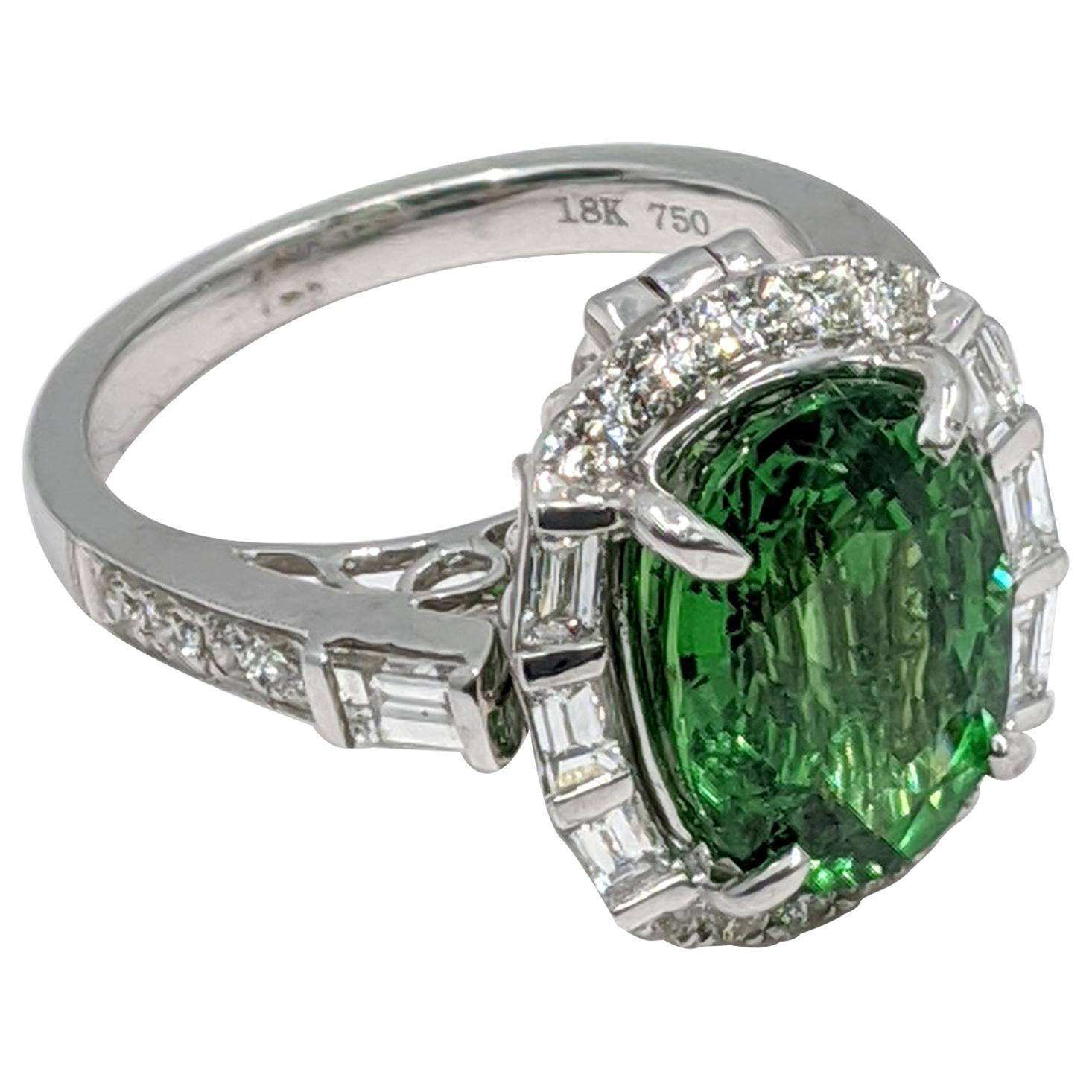 Extremely rare Tsavorite Ring with White Diamonds (19 Carat), Beautiful modernist style, and adjustable to turn into a pendant.