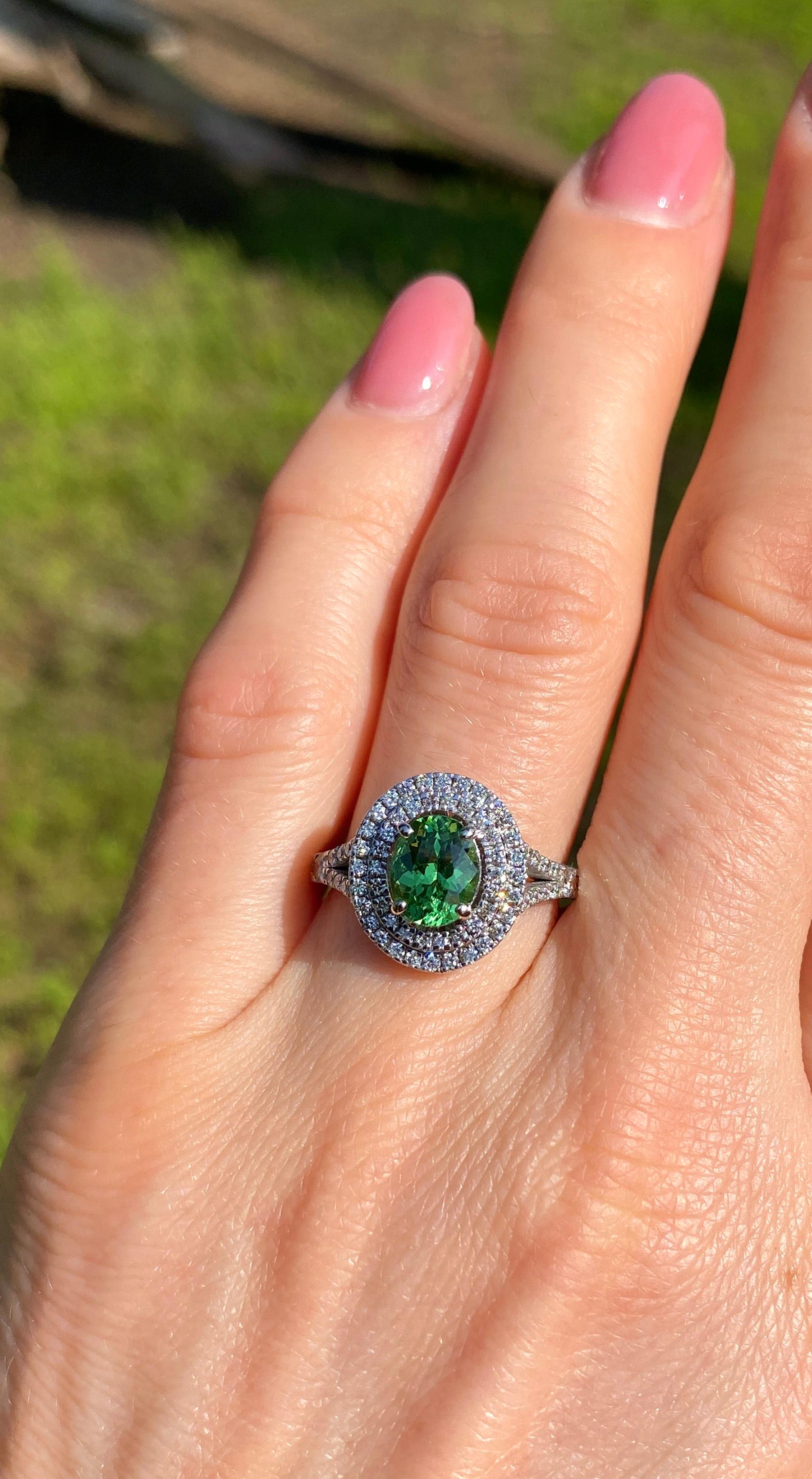 Natural 1.30Ct Tsavorite and Diamonds gemstone
14 Karat White Gold Ring

Laboratory full certificate for the ring
GFCO certificate for stone
Main Stone: Tsavorite Garnet
Main Stone Creation: Natural
Main Stone Color: VIVID Green
Main Stone Origin: