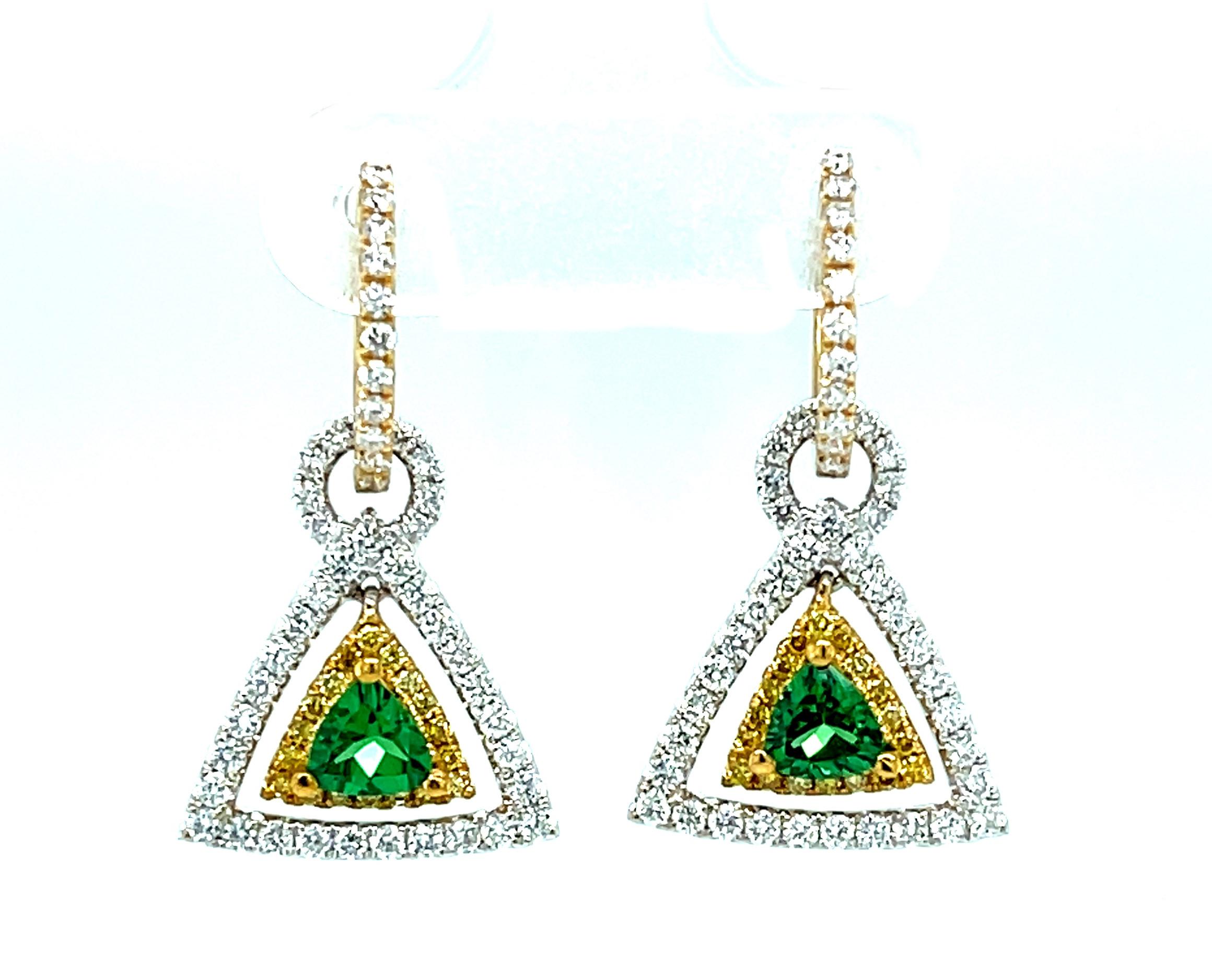These earrings are gorgeous and stunning! Two trillion cut tsavorite garnets are set with round   brilliant-cut diamonds and bright yellow sapphires. The garnets are a beautiful, brilliant grass-green color. The yellow sapphires and diamonds