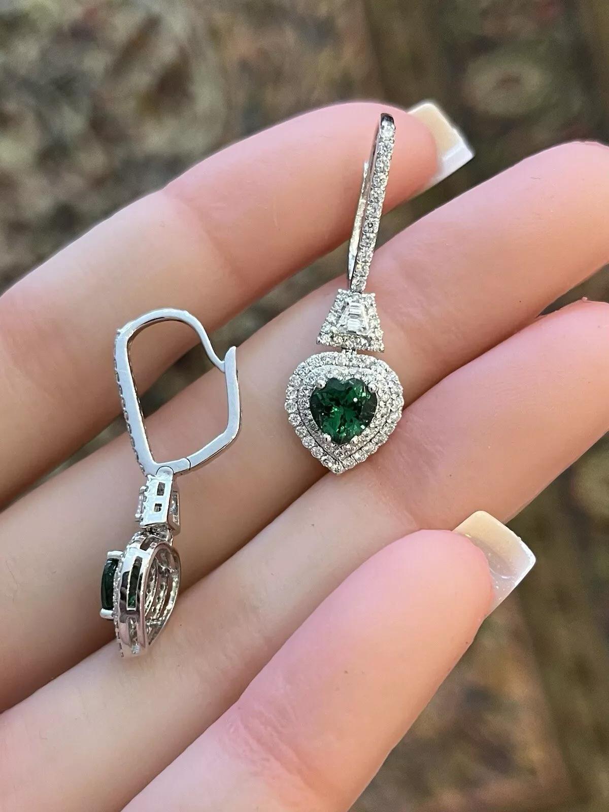 Tsavorite Garnet Hearts and Diamond Drop Earrings in 18k White Gold

Tsavorite and Diamond Earrings feature Heart-shaped Natural Green Tsavorite Garnets accented by Natural Round Brilliant and Natural Trapezoid Diamonds 

Total tsavorite weight is
