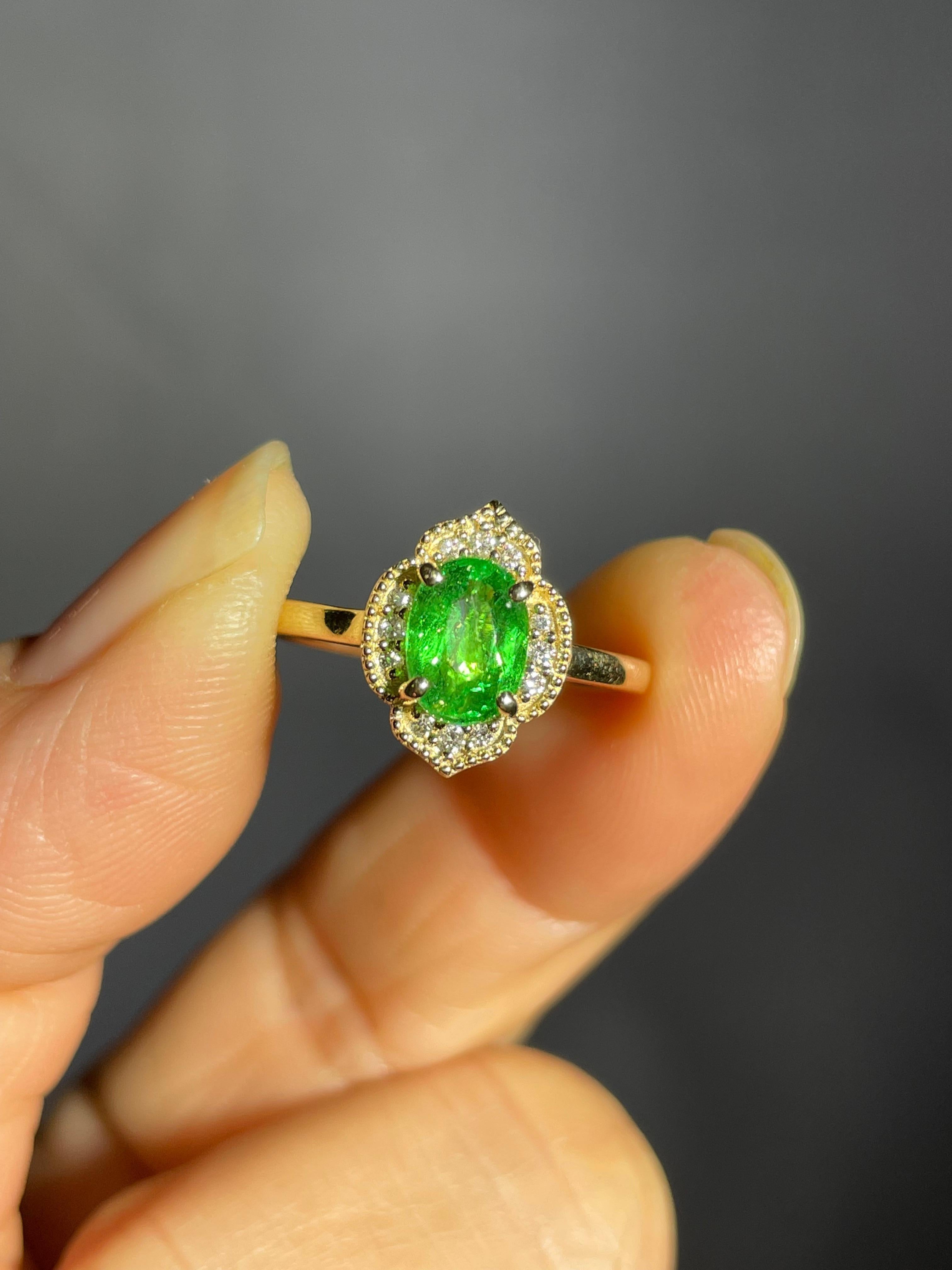 This Edwardian style engagement ring features a Tsavorite Garnet that is close to the color of a pure green emerald. These green garnets are rare to find in sizes larger than 1 carat. 

Tsavorite Garnet qualities are eye clean, more durable and