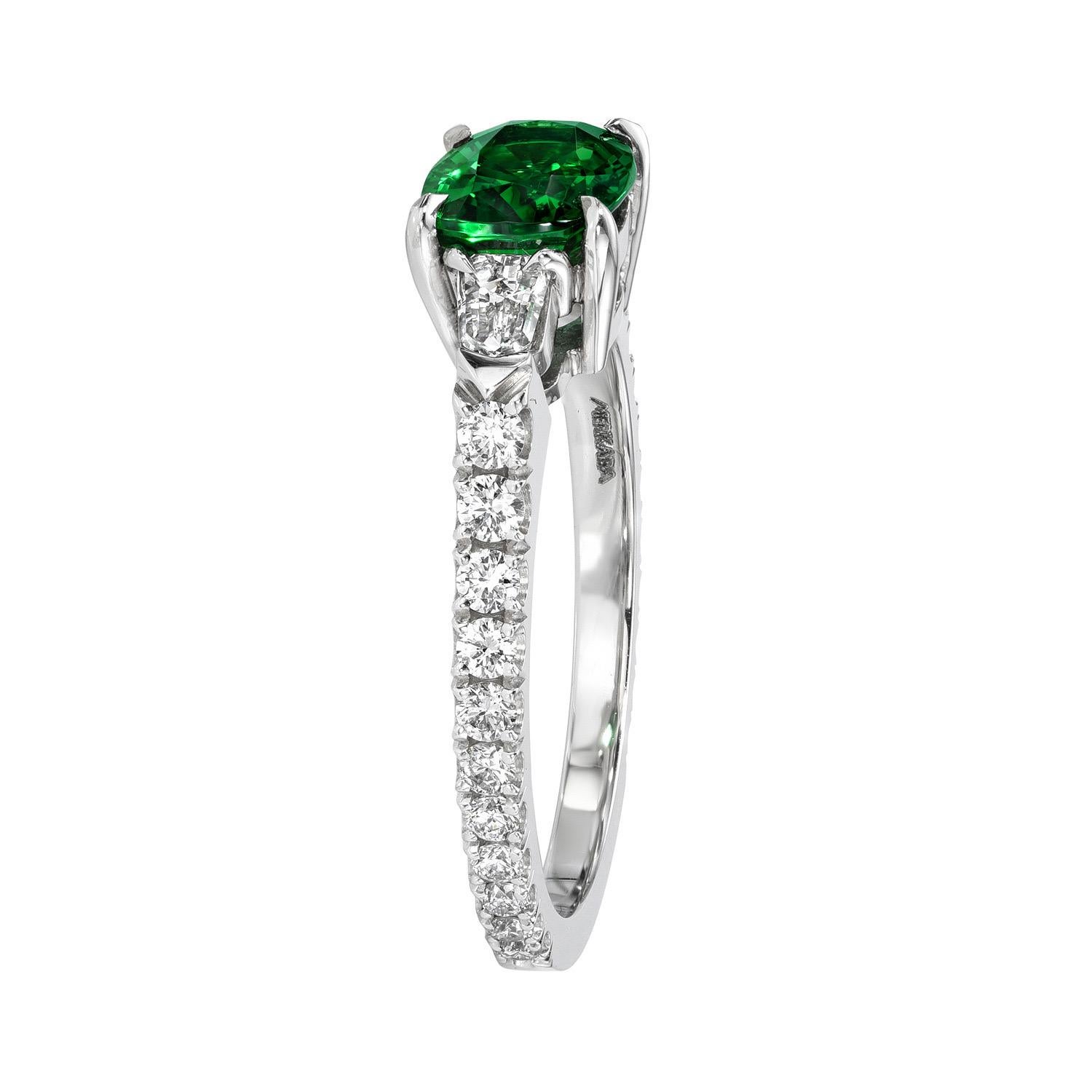 Superb 1.34 carat Tsavorite Garnet cushion platinum ring, flanked by a pair of 0.21 carat D/VS1 diamond bullets, and a total of 0.41 carat round brilliant collection diamonds.
Ring size 6. Resizing is complementary upon request.
Crafted by extremely
