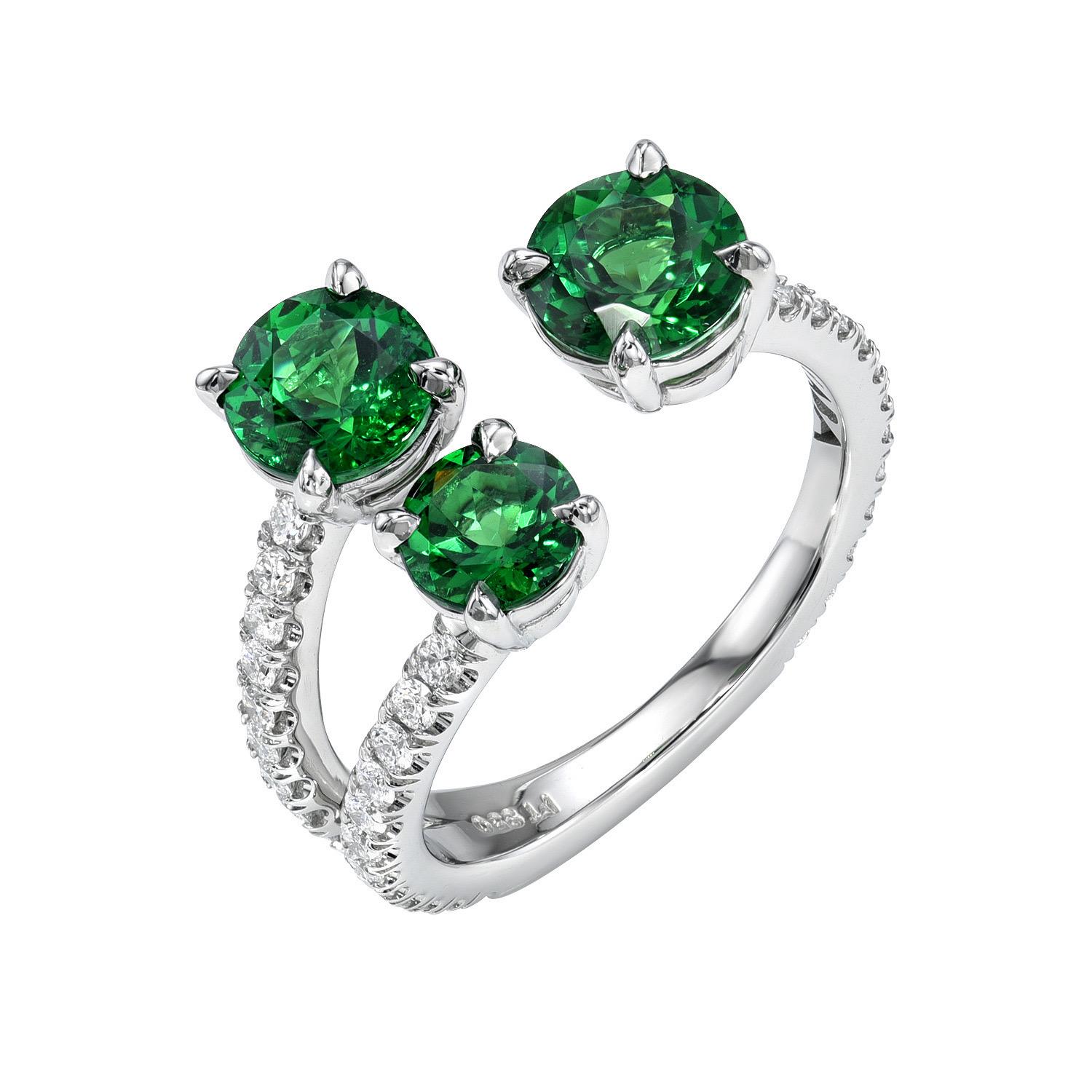 Remarkable platinum ring, set with a total of 2.12 carat Tsavorite Garnet rounds, and decorated with a total of 0.51 carat round brilliant collection diamonds.
Ring size 6. Resizing is complementary upon request.
Crafted by extremely skilled hands