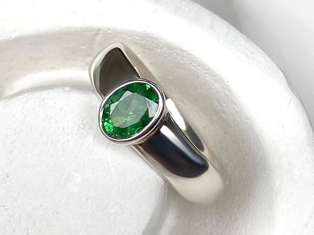 Silver ring with natural Tsavorite Green Garnet 
garnet origin - Tanzania
ring weight - 4.2 grams
ring size - 7 US 
stone measurements - 0.16 х 0.16 x 0.24 in / 4 х 4 x 6 mm