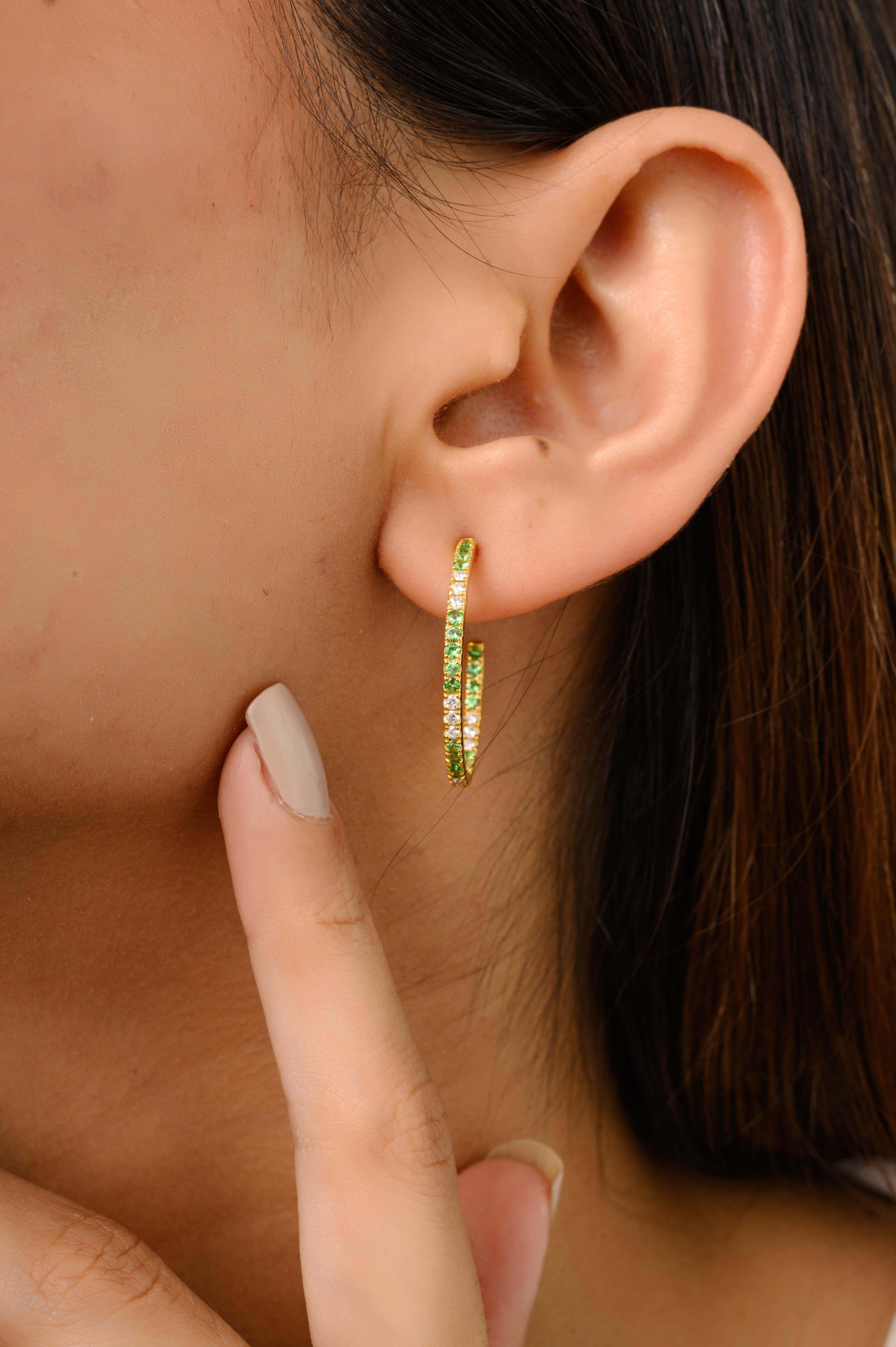 Tsavorite Gemstone and Diamond Thin C-Hoops in 18K Gold to make a statement with your look. You shall need hoop earrings to make a statement with your look. These earrings create a sparkling, luxurious look featuring round cut tsavorite and