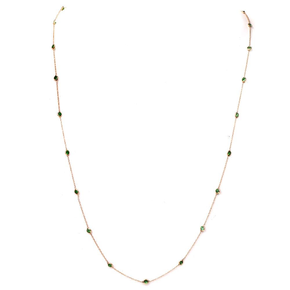 This tsavorite long necklace chain is crafted in 14K yellow gold. Featuring 25 bezel set round-cut tsavorite’s approx. 3.75ct. This stylish chain necklace is ideal for layering, measures approx. 27 inches long and weighs 3.5 grams. Secures with a