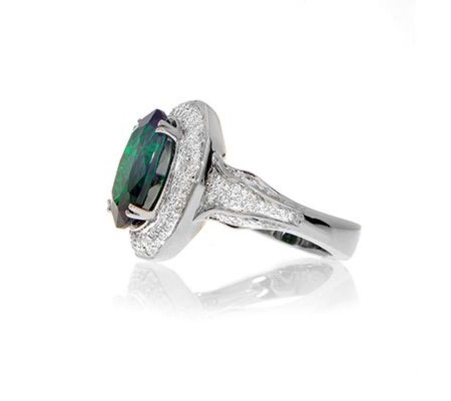 TSAVORITE RING WITH
DIAMONDS
An unusually large Tsavorite is the magnificent centerpiece of this
diamond ring.
Item: # 01410
Metal: 18k W
Color Weight: 5.06 ct.
Diamond Weight: 0.93 ct.