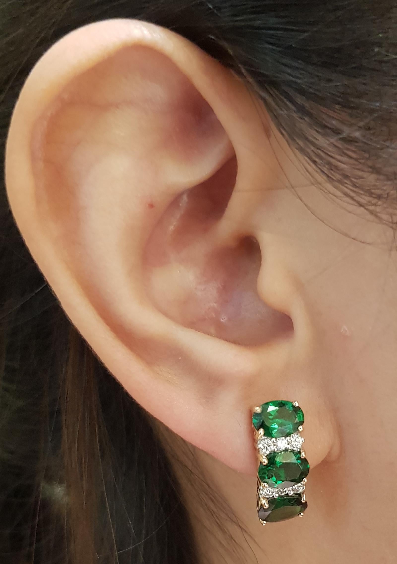 Tsavorite 4.92 carats with Diamond 0.24 carat Earrings set in 18 Karat Rose Gold Settings

Width:  1.8 cm 
Length:  0.6 cm
Total Weight: 5.94 grams

