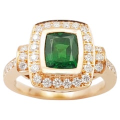 Anello con tsavorite e diamanti incastonati in oro rosa 18 carati