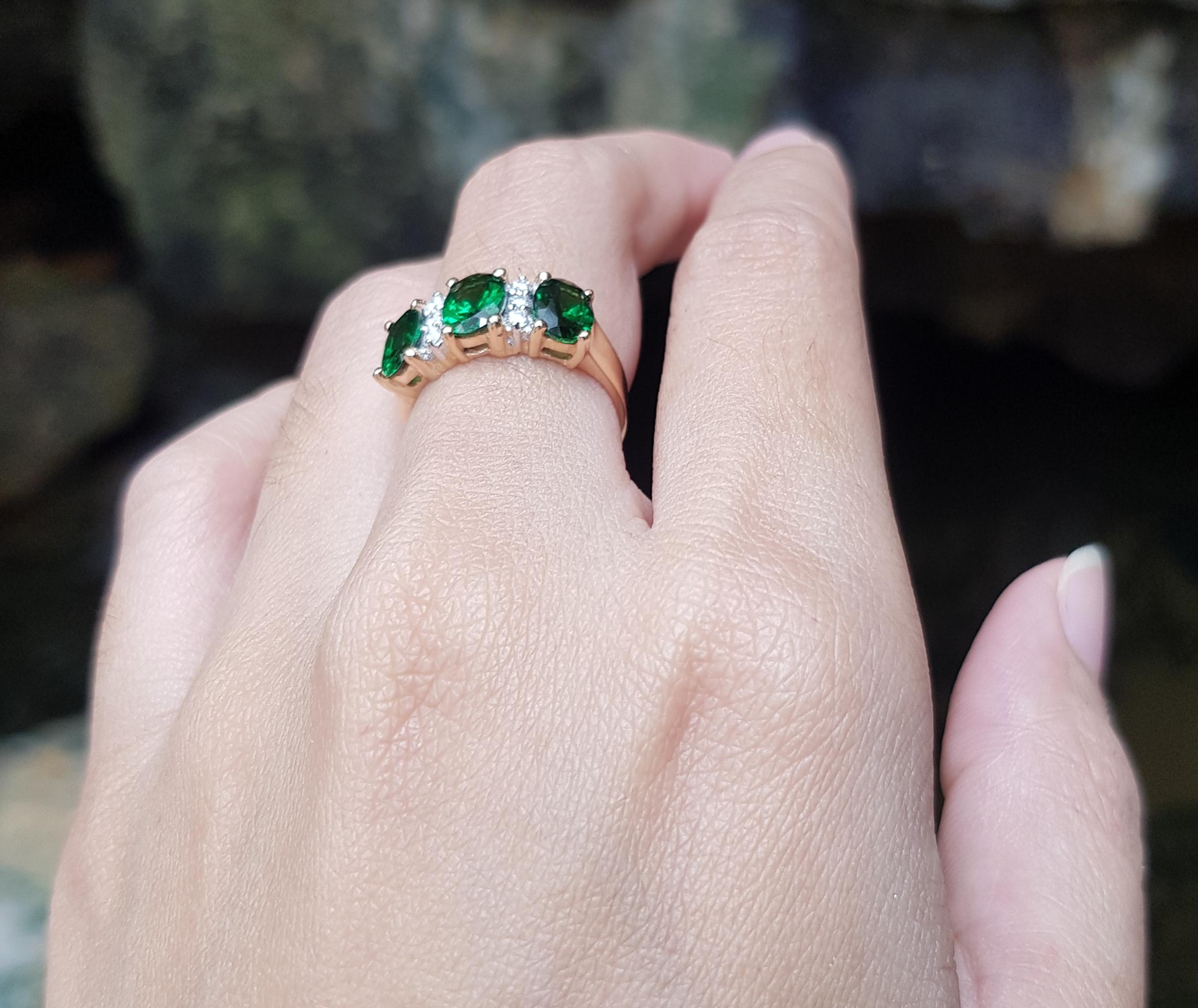 Oval Cut Tsavorite with Diamond Ring Set in 18 Karat Rose Gold Settings For Sale