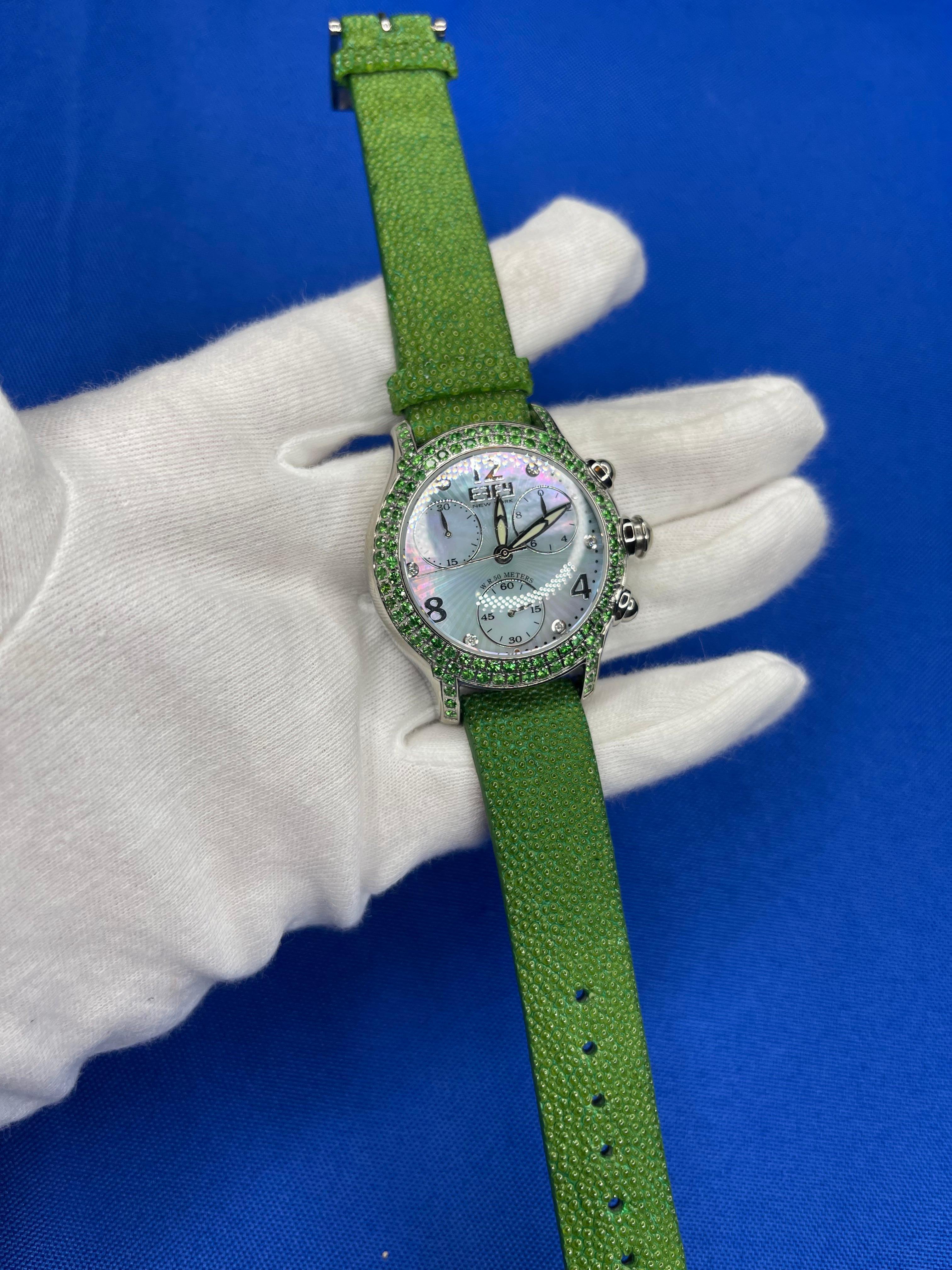 ·      Quality Swiss-Quartz movement guarantees precision timing
·         Mother-of-Pearl dial micro-paved with diamonds and gemstones enhances any dress style
·         Scratch-resistant sapphire glass lens
·         Genuine exotic lizard leather