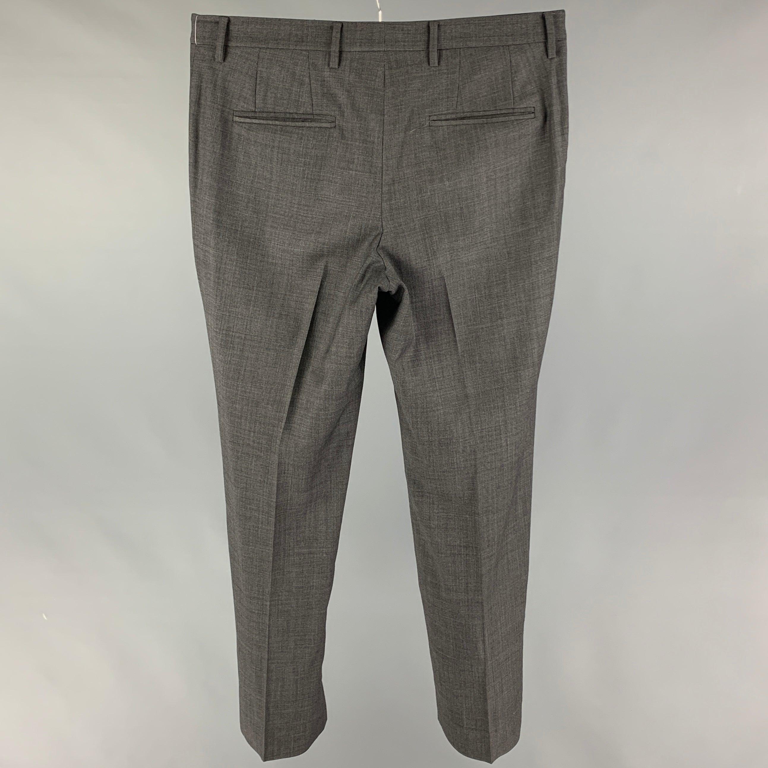 TSE dress pants comes in a grey wool featuring a flat front, zip fly, and a single button closure.
Very Good
Pre-Owned Condition. 

Marked:   34 

Measurements: 
  Waist: 34 inches  Rise: 11 inches  Inseam: 31 inches 
  
  
 
Reference: