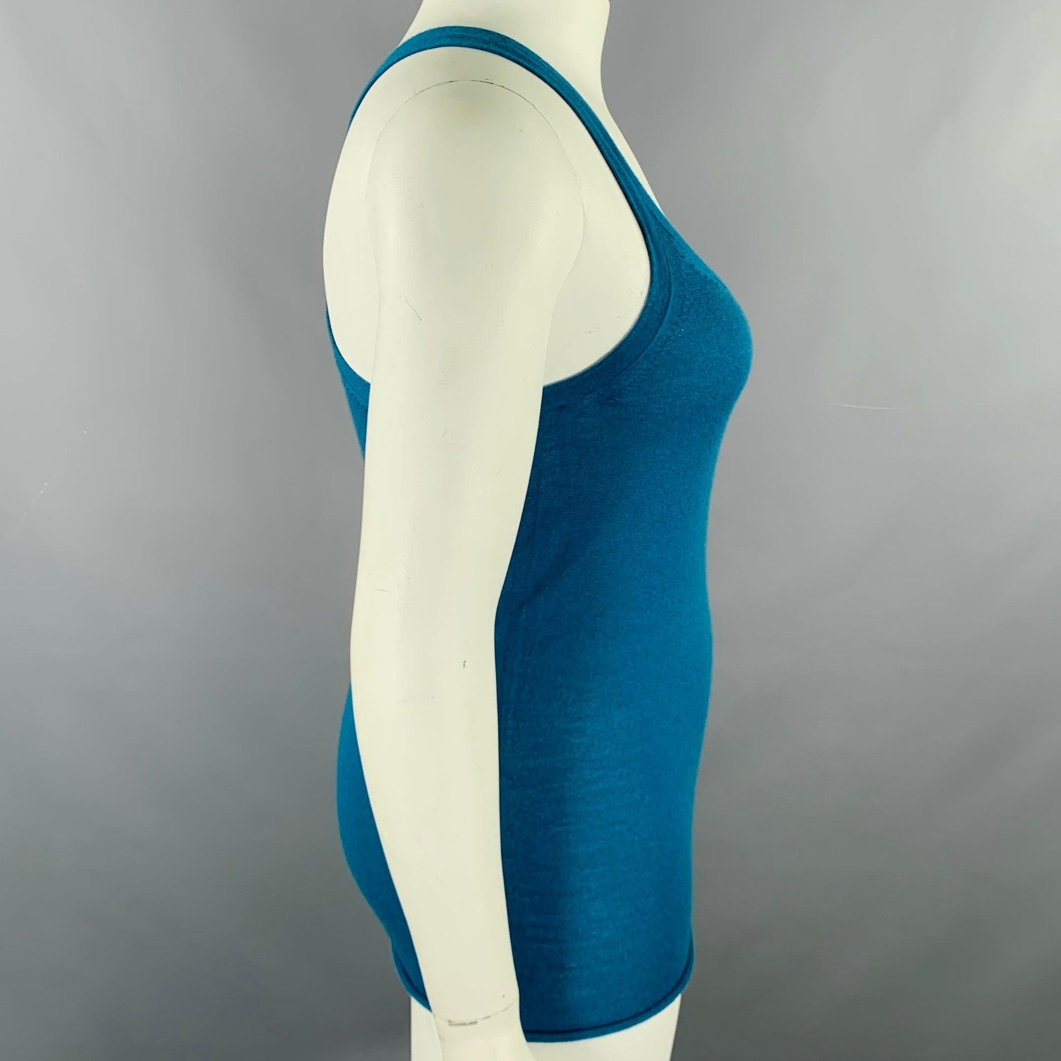TSE casual tank top
in a blue knit fabric featuring a racerback style.Excellent Pre-Owned Condition. 

Marked:   size not marked, fabric and care tags removed. 

Measurements: 
 
Shoulder: 9.5 inches Bust: 30 inches Length: 25 inches 
  
  
 
Sui