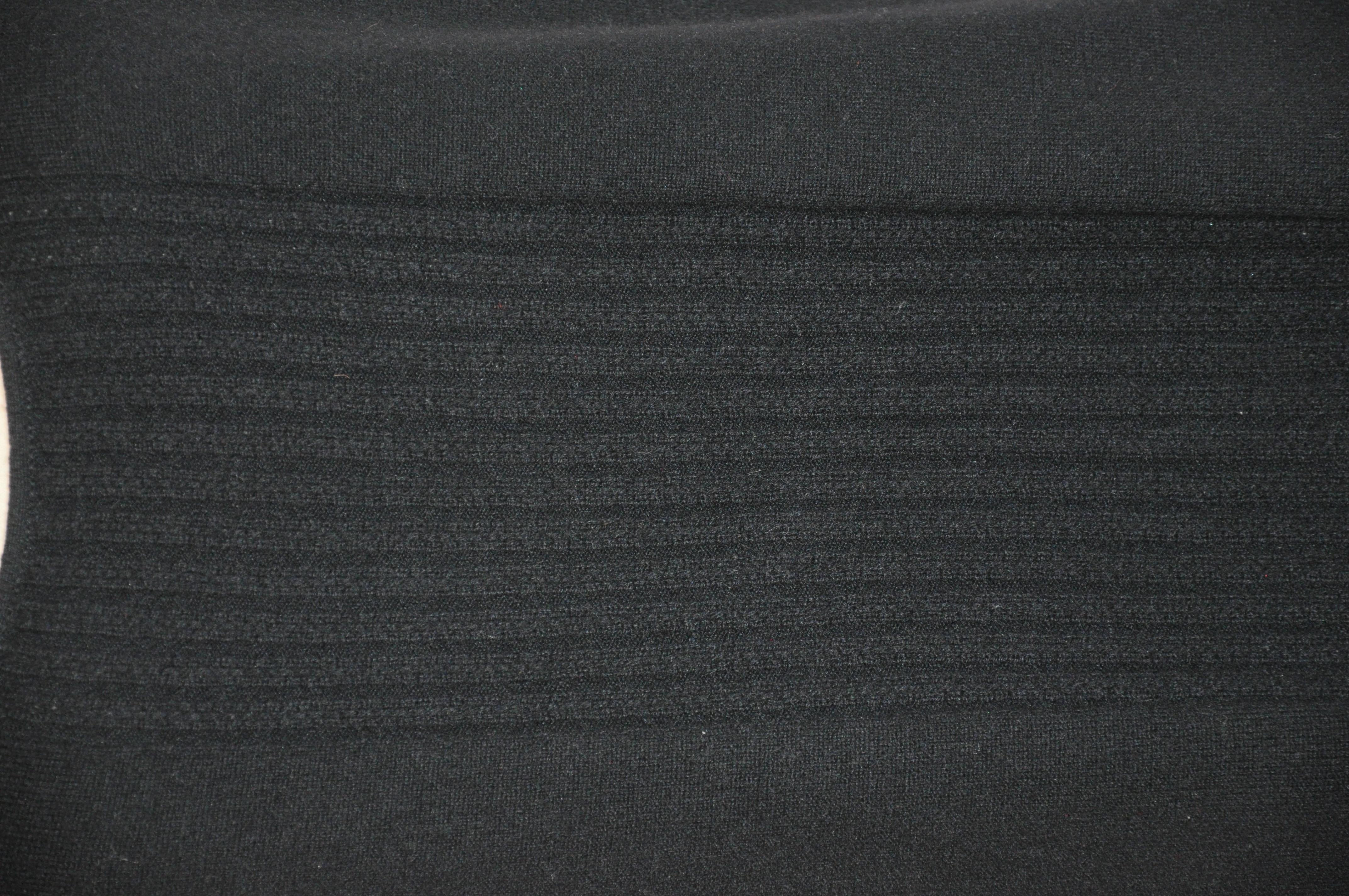 TSE wonderfully soft black 2-ply cable center cashmere tank top measures 18 1/2 inches in length in front, and 24 1/4 inches in length in back. Underarm measures 35 inches, waist is 37 inches, hem is 39 inches. Please note: measurements are taken at