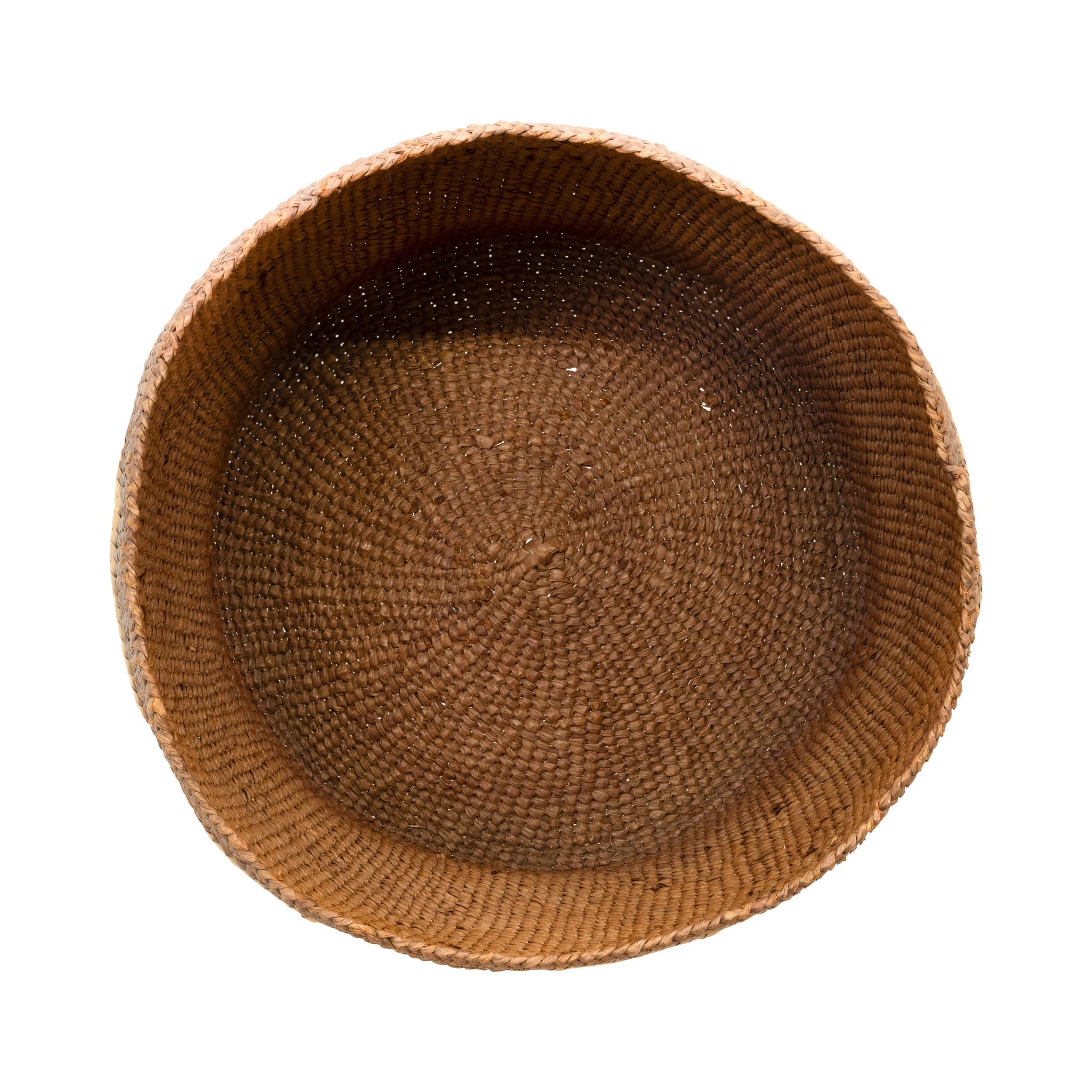 Tsimishian lidded basket. With dark brown base color and geometric zig-zag design created in lighter natural fiber. Finely woven. Beautiful piece for display or careful continued use. 20th century. Size: 9