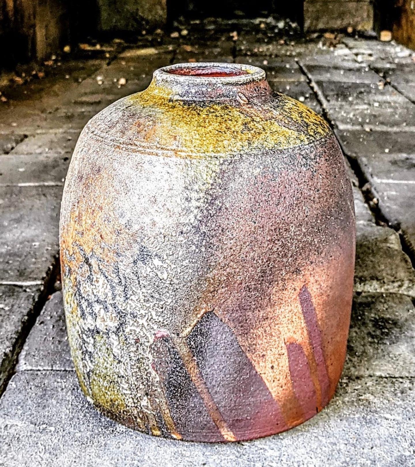 A strong woodfired tsubo with good markings, shino and natural ash glaze.