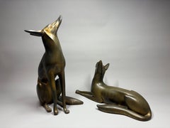 TSUDA SHINOBU (1875-1946), a pair of Japanese Art Deco bronze models of foxes