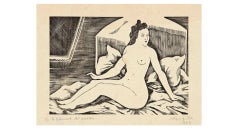 Femme nue sur un lit