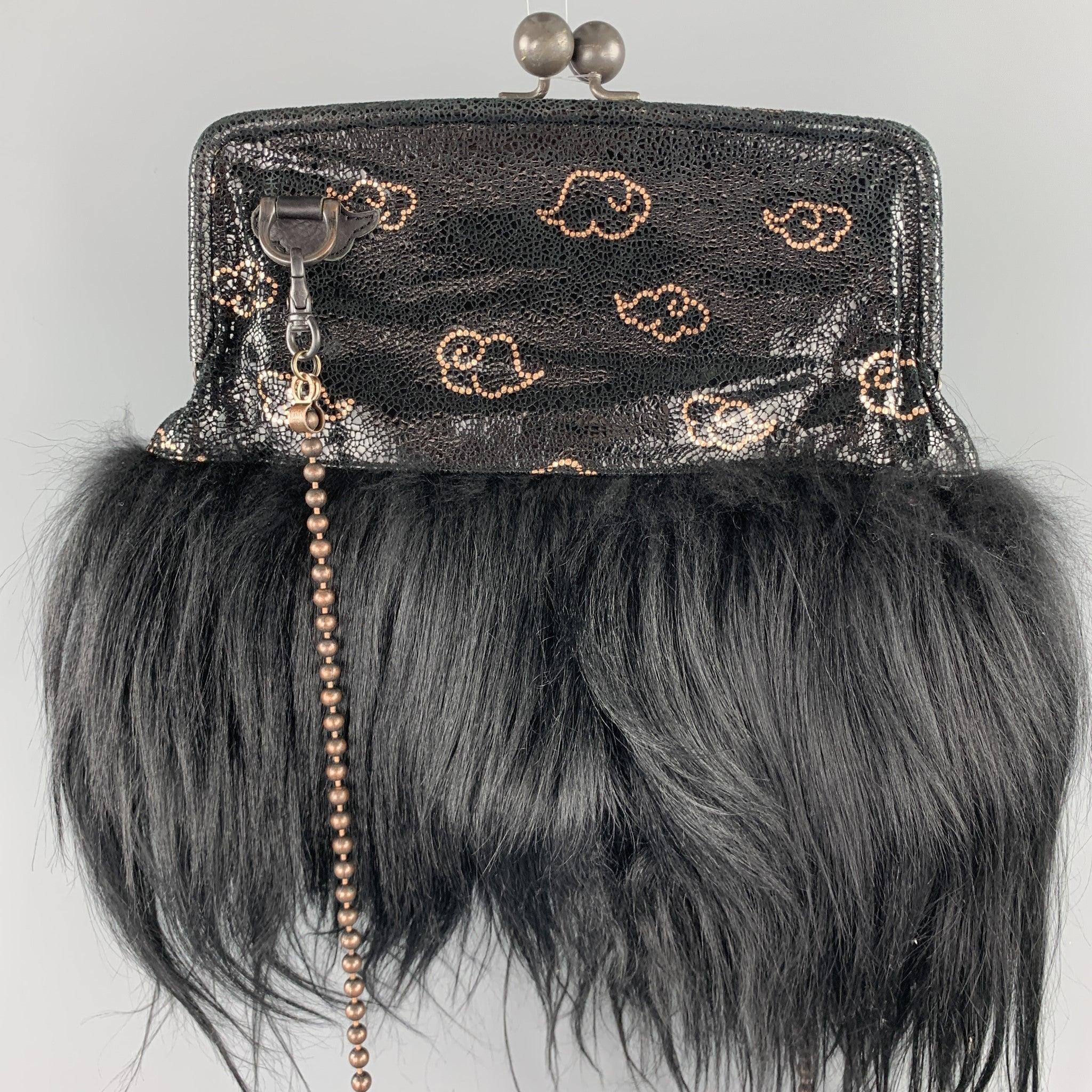 TSUMORI CHISATO kiss lock bag comes in black textured leather with a metallic copper print, detachable bronze ball chain strap, and goat hair trim. Wear throughout.
Very Good
Pre-Owned Condition. 

Measurements: 
  Length:10 inches Width:
1 inches