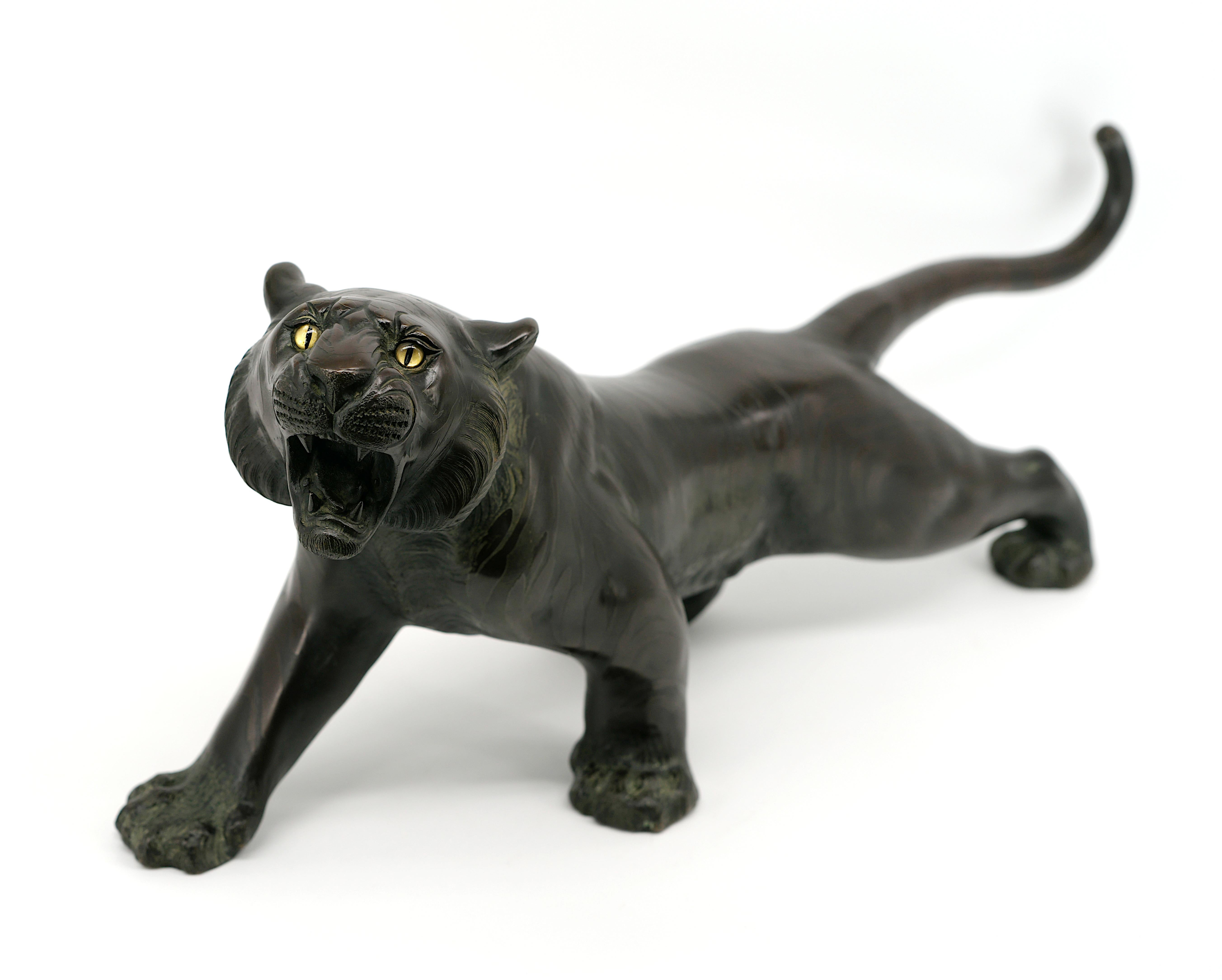 Bronze Roaring Tiger with Terrifying Eyes by TSUNEMITSU, Japan, Meiji Period (1868-1912).

This magnificent bronze sculpture of a roaring tiger, created by Japanese artist Tsunemitsu during the Meiji Period (1868-1912), exemplifies extraordinary