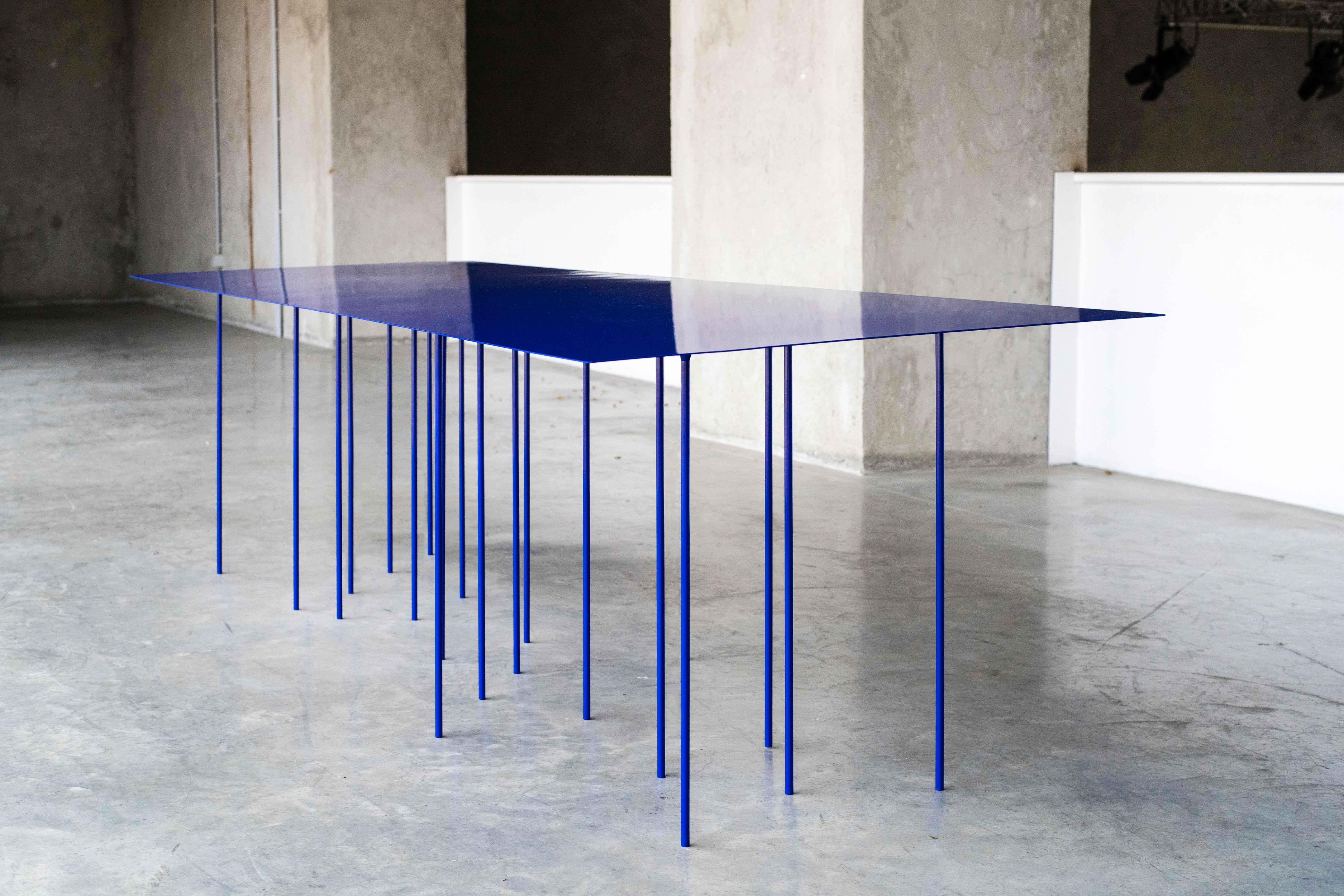 TTTTable by MOB 
Designer: BAST (France)
Dimensions: H 72 x D 110 x W 300 cm
Material: 2mm steel sheet, 2mm aluminium sheet, 10mm steel bar, Klein Blue medium glossy painting.

The board of a table is much more than a mere support: it is a line