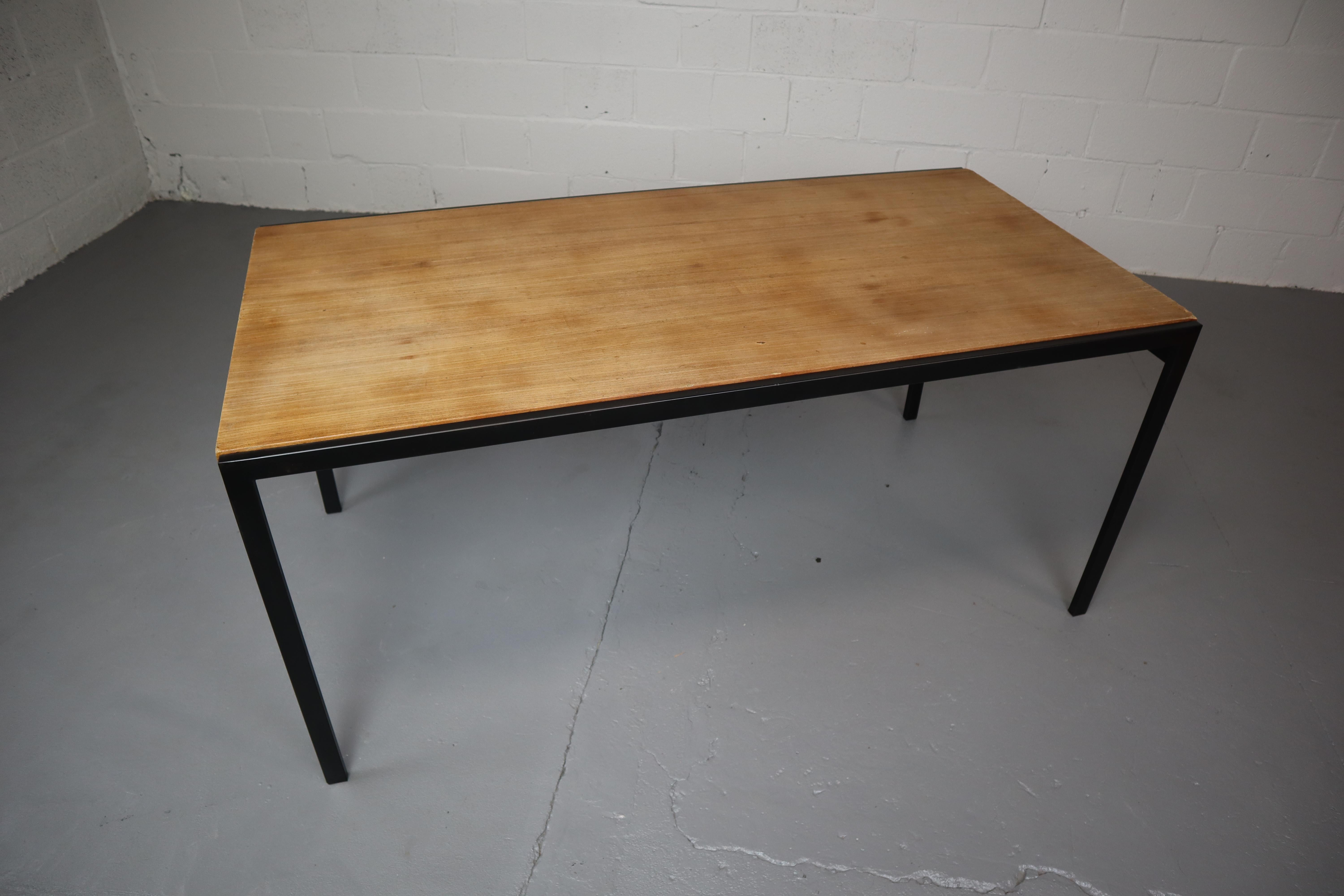 Dutch vintage design dining table from the early sixties. The table, TU30, was designed by Cees Braakman as part of the Japanese series that he designed for Pastoe furniture. Minimalist design with a black metal frame and Teak veneer