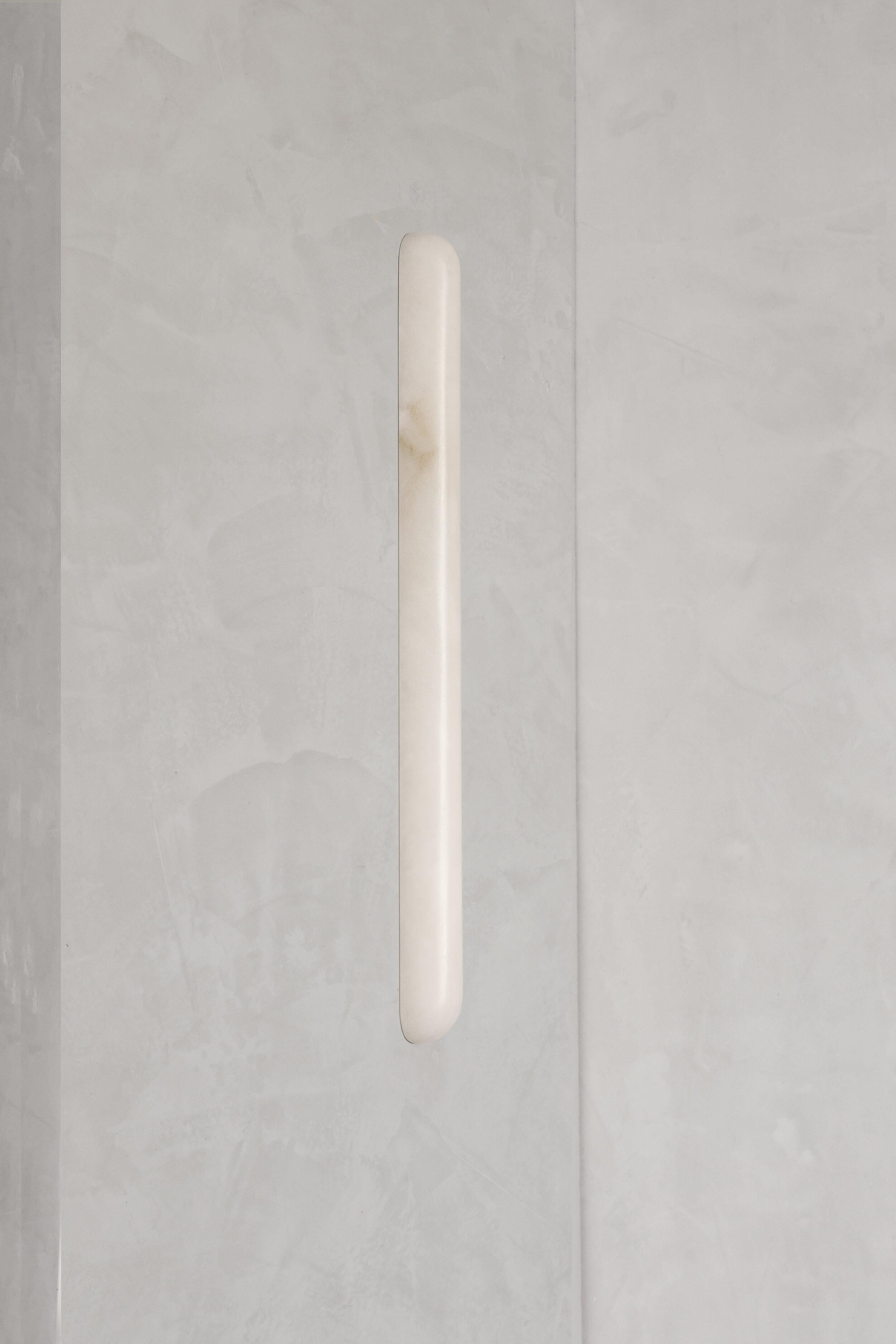 Tub 60 Alabaster wall light by Contain.
Dimensions: D 4 x W 4 x H 60 cm
Materials: Alabaster
Also available in different dimensions.

All our lamps can be wired according to each country. If sold to the USA it will be wired for the USA for
