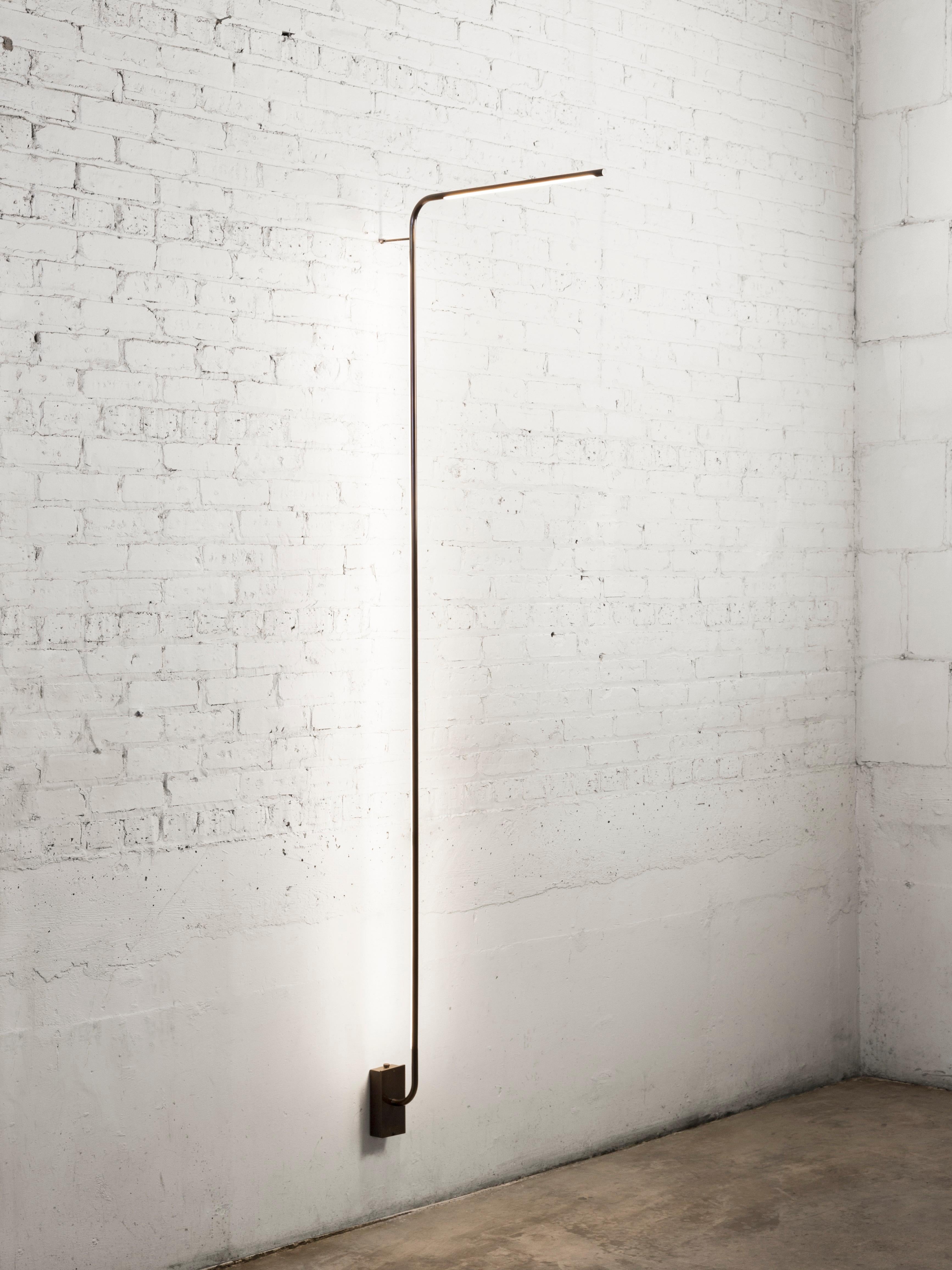 Tube brass wall lamp by Gentner Design
Dimensions: D 68.5 x W 7.5 x H 221 cm
Materials: hand rubbed brass
Available in darkened brass and hand rubbed brass.

All our lamps can be wired according to each country. If sold to the USA it will be