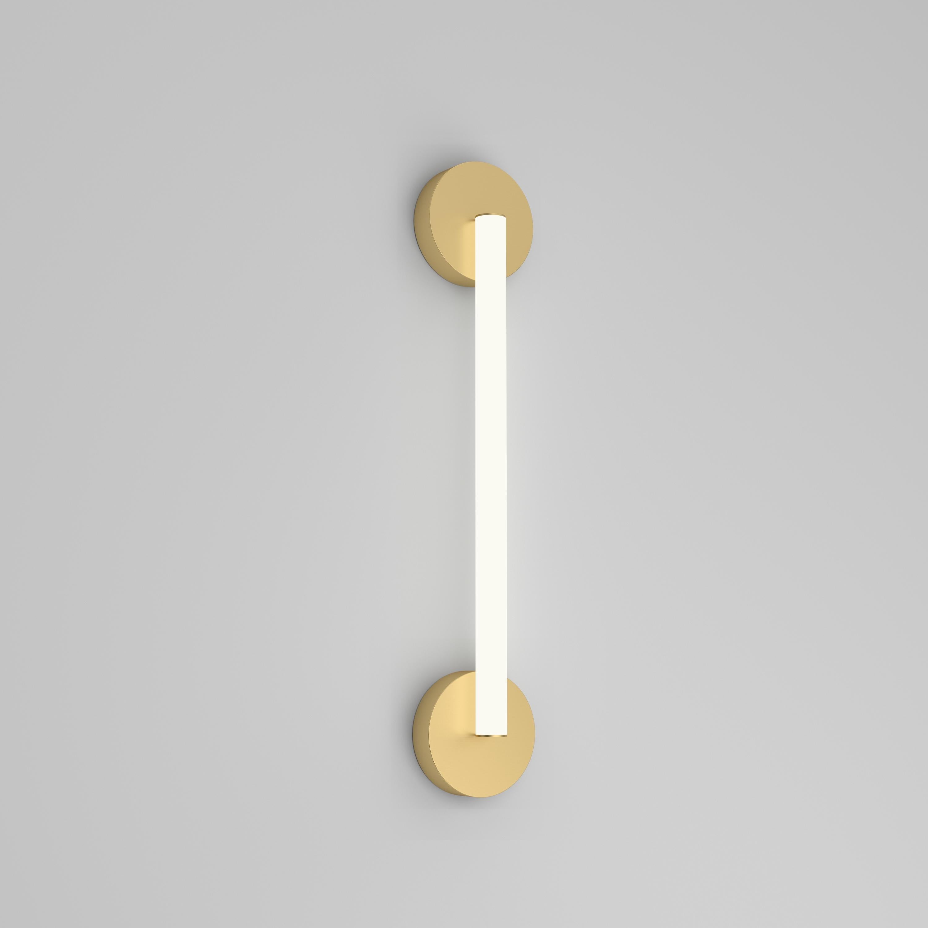 Tube Circle Brass Wall Light by Atelier Areti
Dimensions: D 6 x W 12 x H 61.5 cm.
Materials: Brushed brass, white acrylic.

Available in triangle, rhombus, or circle versions.
Available in brass, brass and color, nickel, or nickel and color. Please